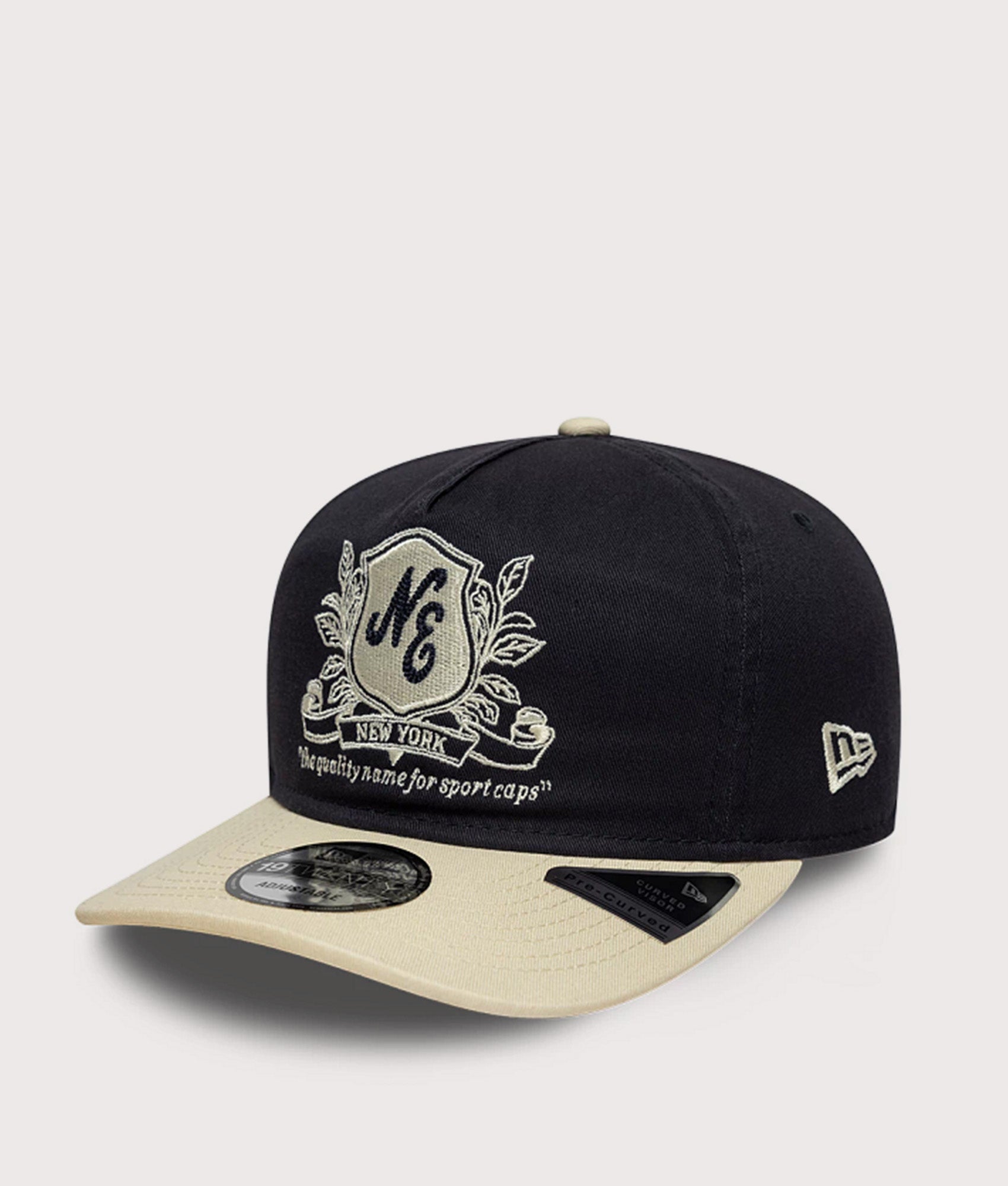 New Era New Era Washed Graphic 19TWENTY Adjustable Cap in Navy and Cream at EQVVS Menswear. Angled front shot.