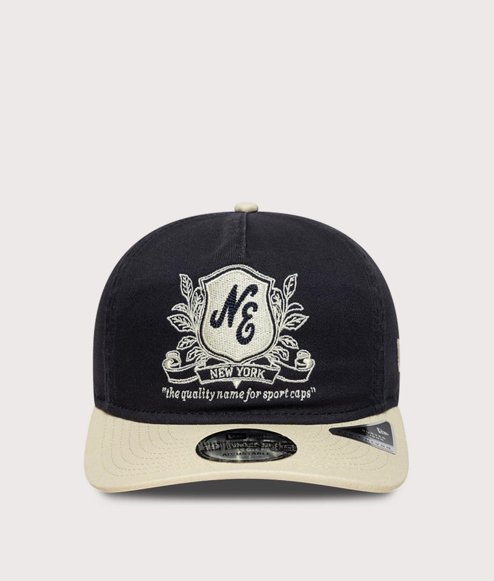New Era New Era Washed Graphic 19TWENTY Adjustable Cap in Navy and Cream at EQVVS Menswear. Front shot.