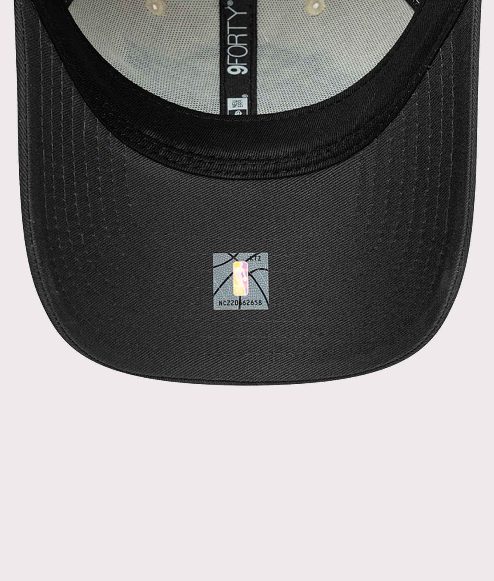 New Era LA Lakers NBA Colour Block 9FORTY Adjustable Cap in Cream and Black at EQVVS Menswear. Peak shot.