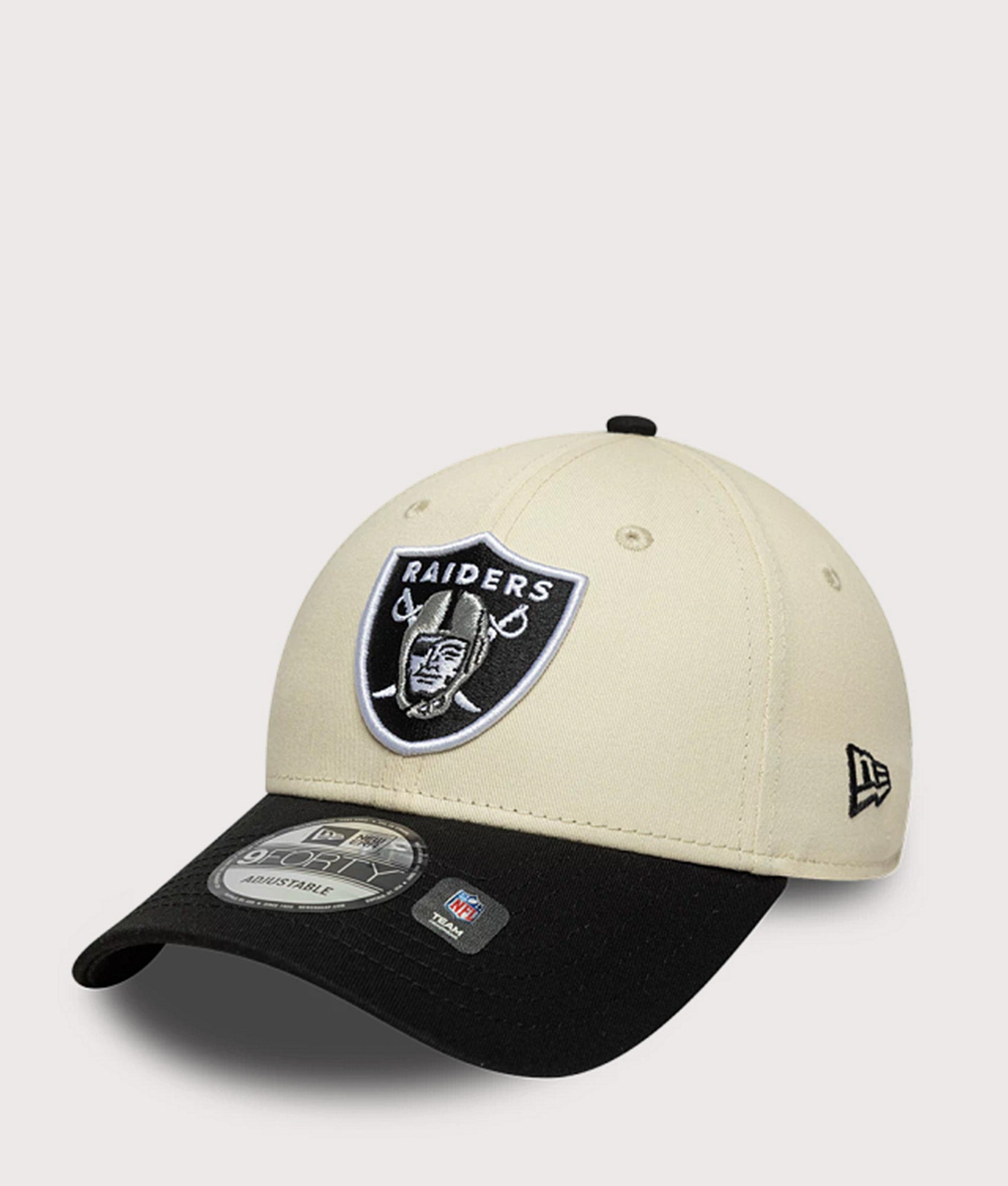 New Era Las Vegas Raiders NFL Colour Block 9FORTY Adjustable Cap in Cream and Black at EQVVS Menswear. Angled front shot.