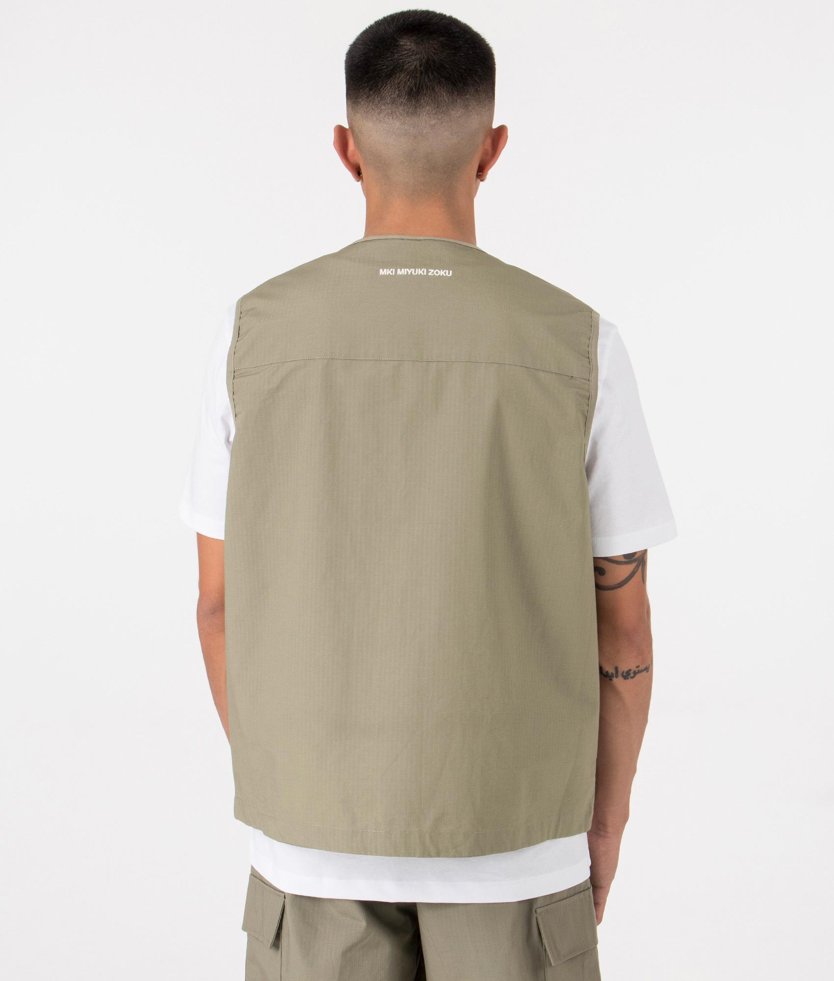 MKI Oversized Ripstop Cargo Vest in Sage Green. Back angle model shot at EQVVS.