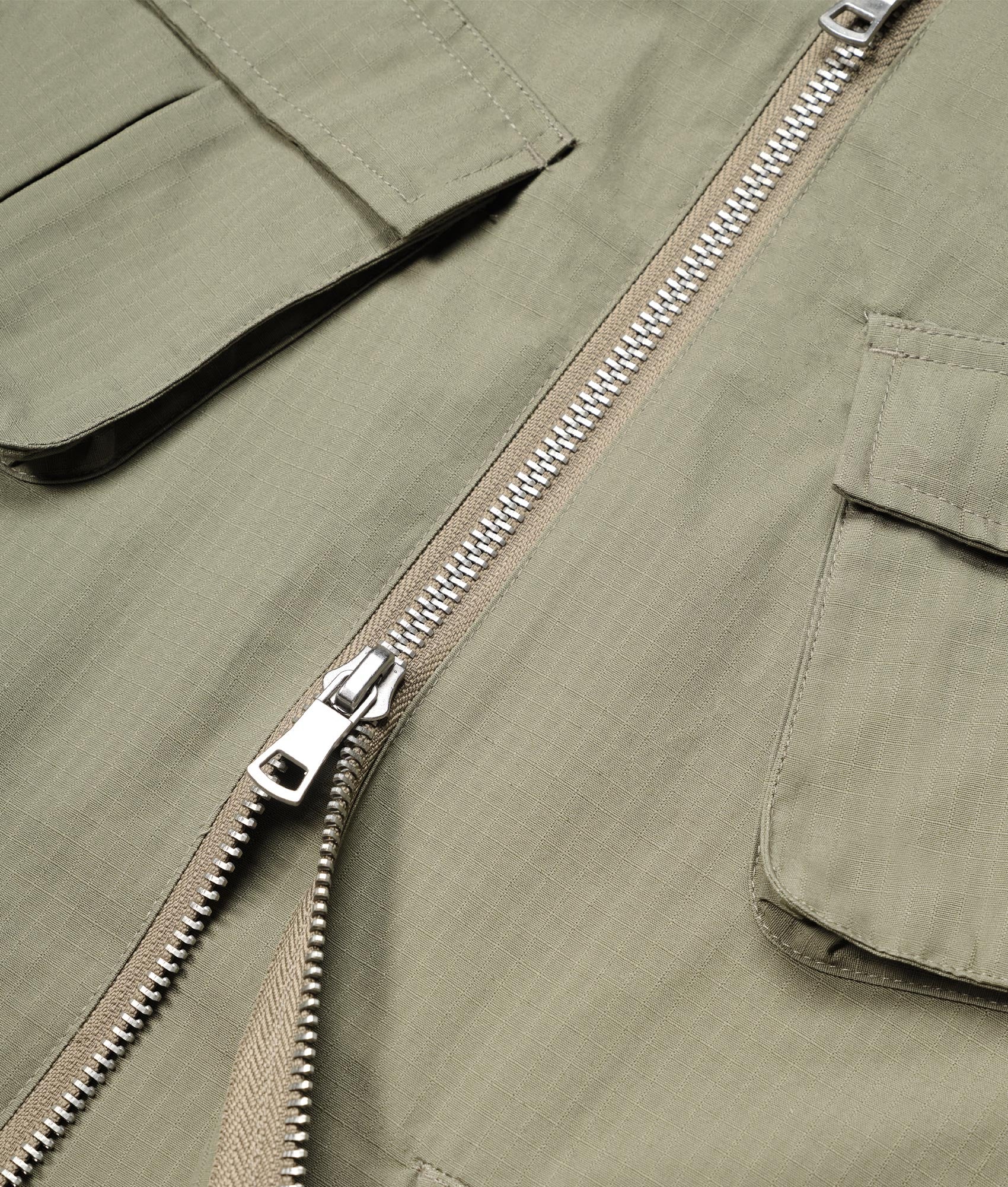 Oversized Ripstop Cargo Vest in Sage Green by MKI MIYUI ZOKU. EQVVS Detail Shot.