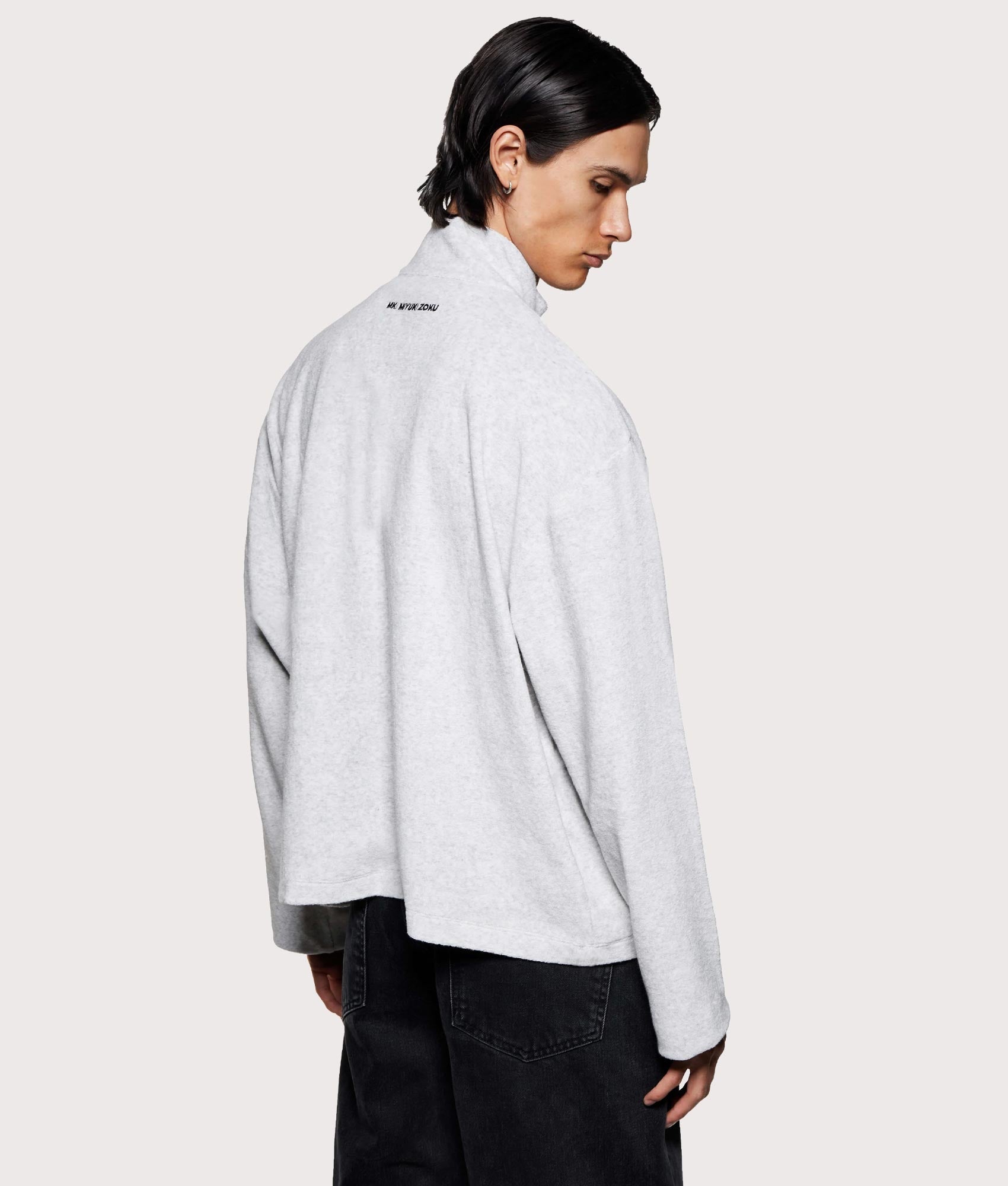 MKI MIYUKI ZOKU Towelling Quarter Zip Sweatshirt in Ash at EQVVS Menswear. Angled back shot.