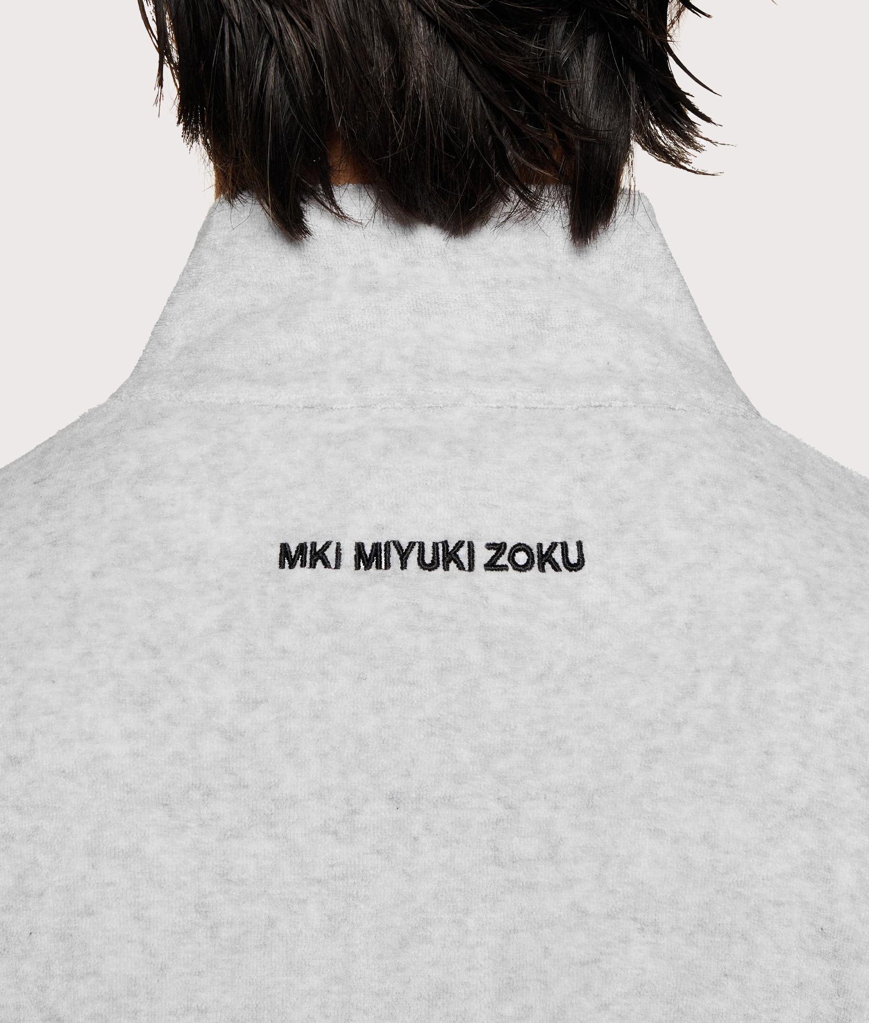 MKI MIYUKI ZOKU Towelling Quarter Zip Sweatshirt in Ash at EQVVS Menswear. Detail shot.