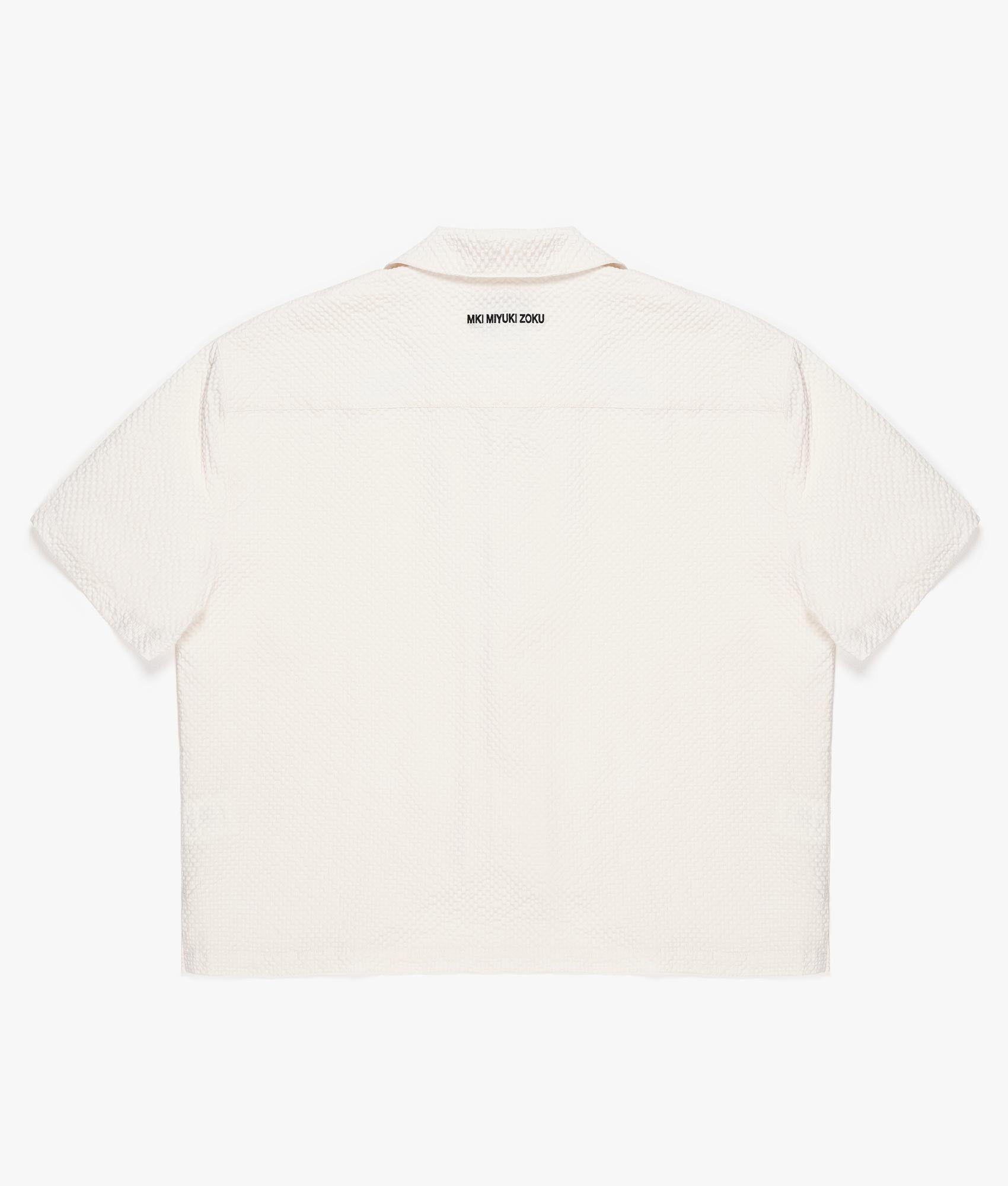 MKI Oversized Loose Gauge Polo Shirt in Off White. Back angle  shot at EQVVS.