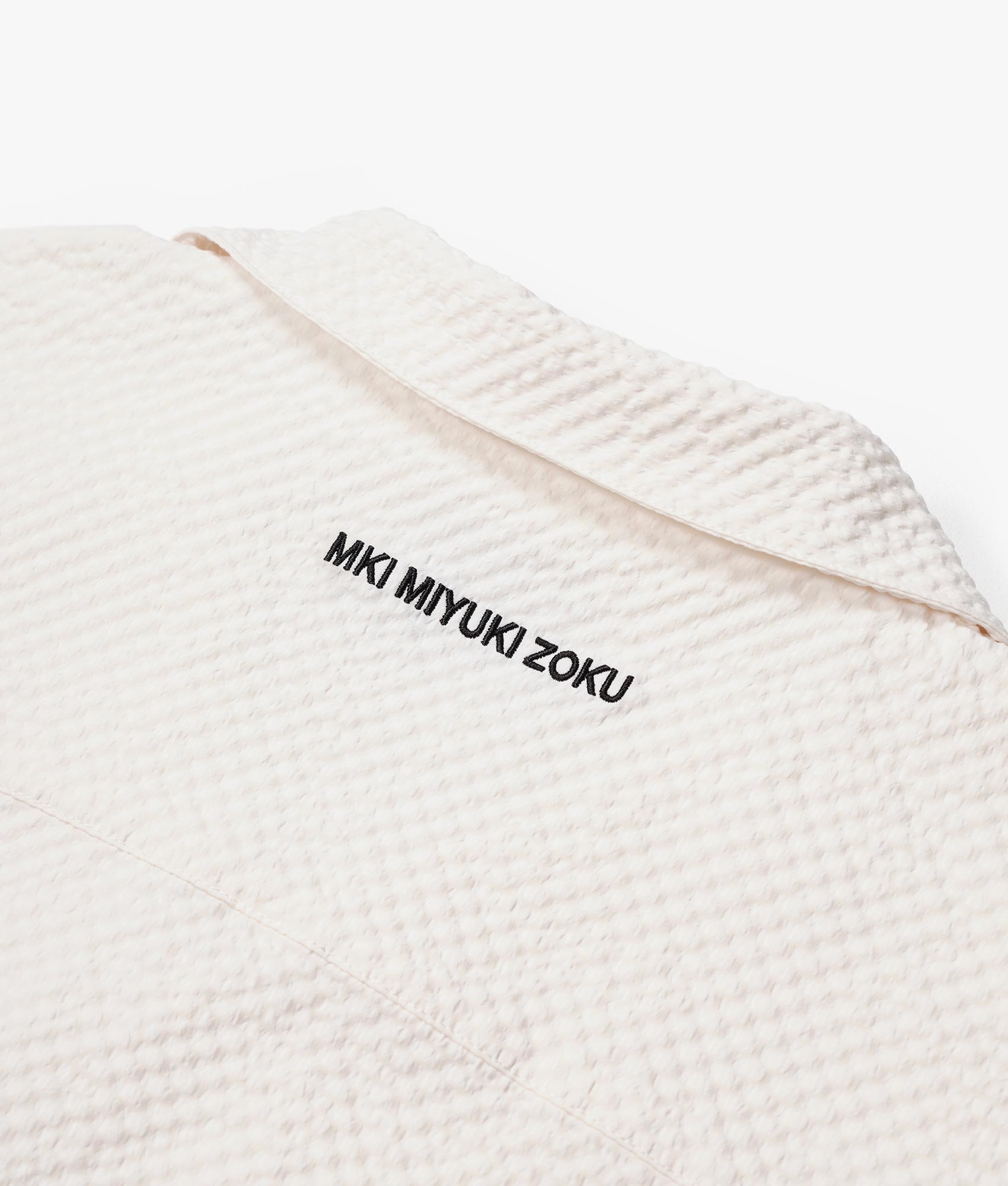 Oversized Seersucker Vacation Shirt in Off White by MKI MIYUKI ZOKU. EQVVS Flat Detail Shot.
