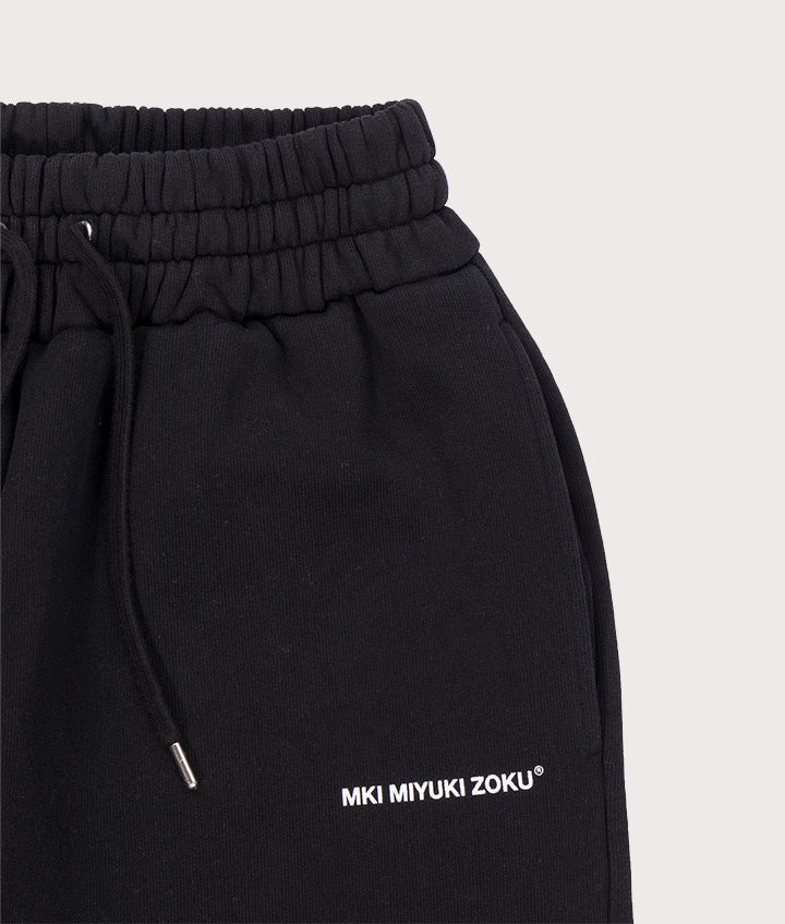 MKI Miyuki Zoku Uniform Joggers in black at EQVVS Menswear. Detail shot.