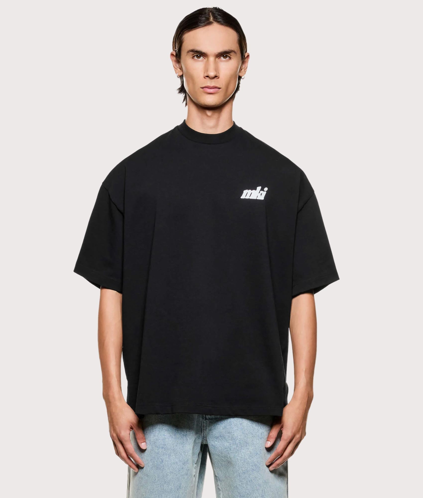 MKI MIYUKI ZOKU Stamp T-Shirt in Black at EQVVS Menswear. Model front shot.