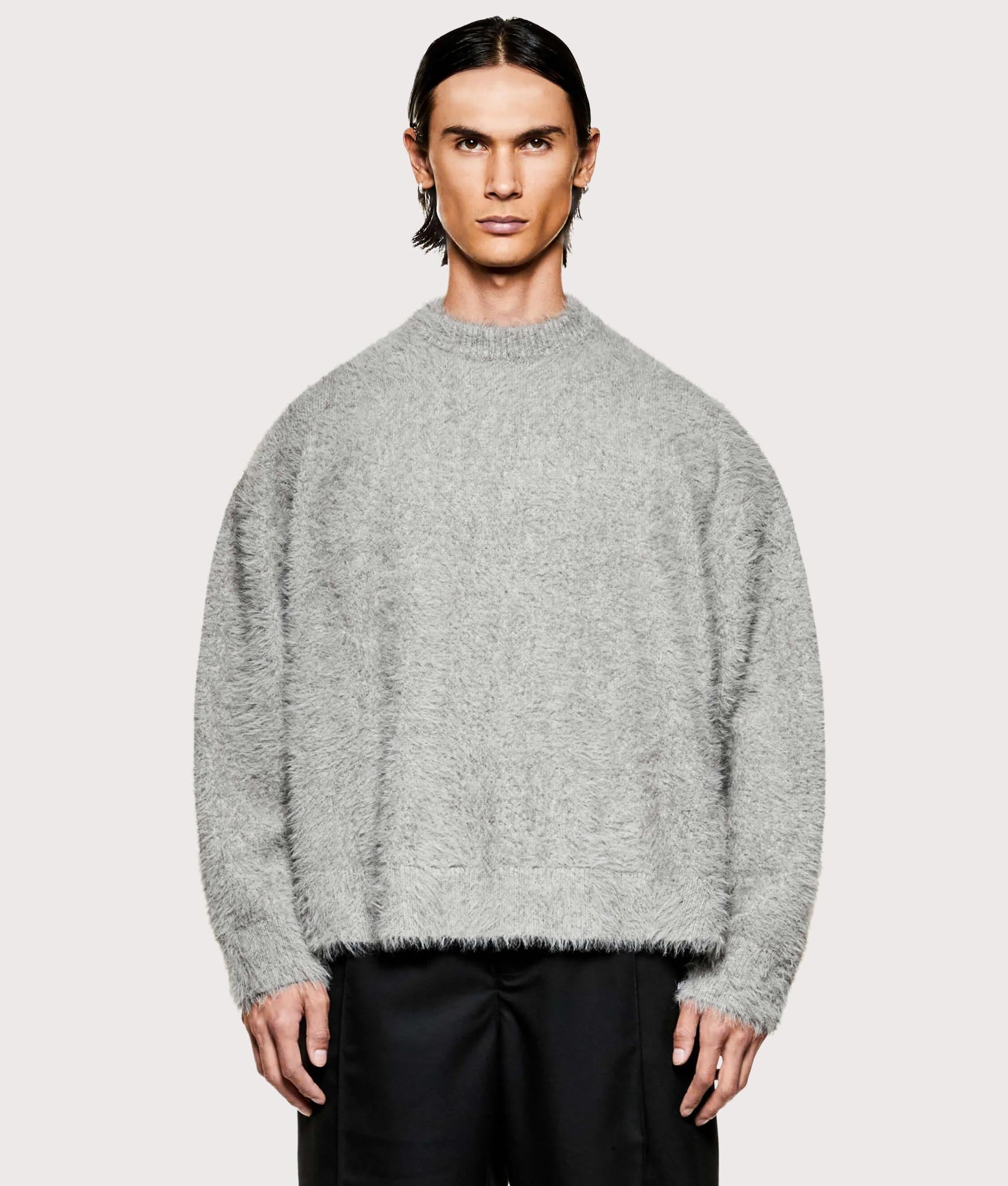 MKI MIYUKI ZOKU Faux Alpaca Knit Crewneck Jumper in Charcoal Melange at EQVVS Menswear. Model front shot.