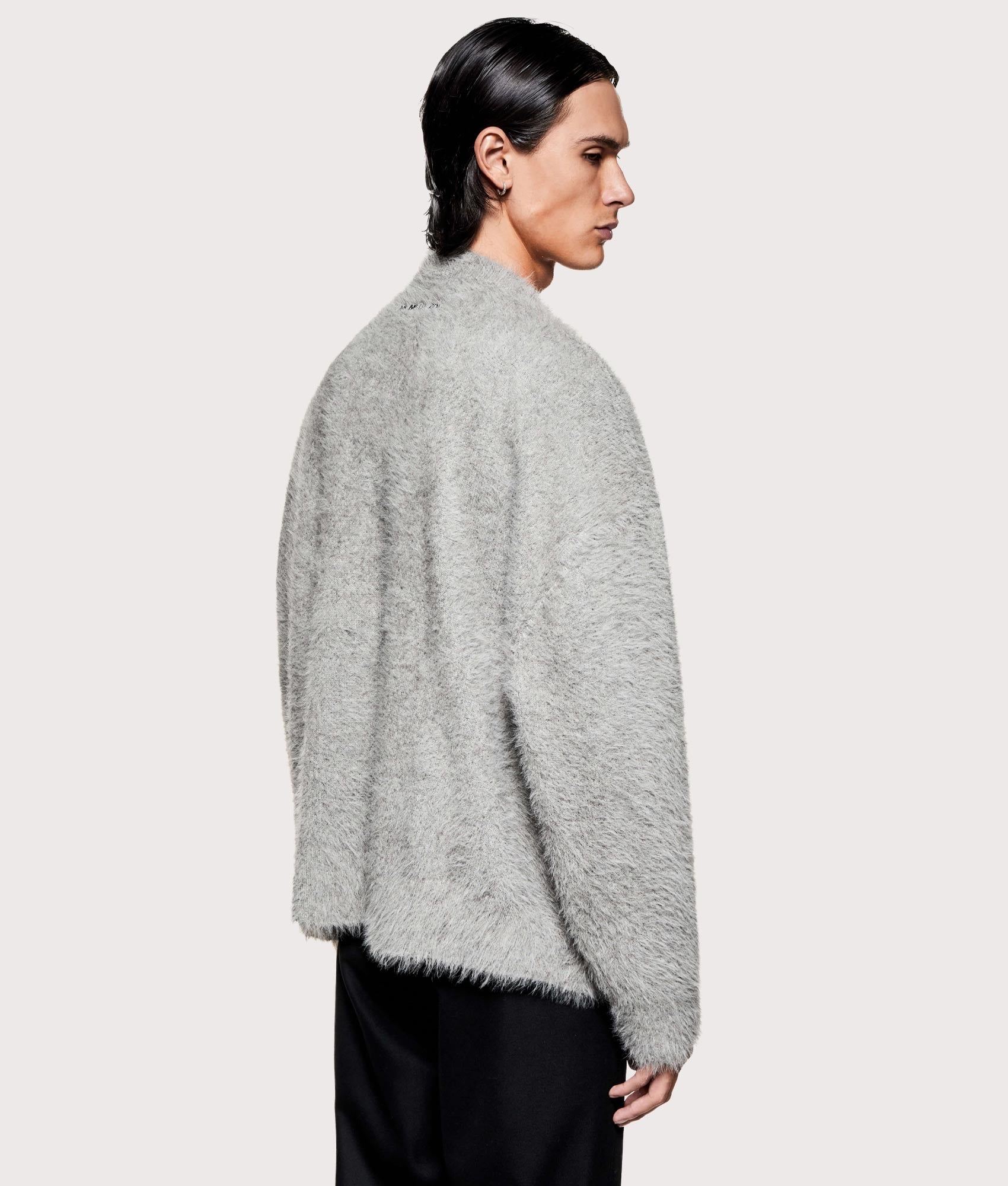MKI MIYUKI ZOKU Faux Alpaca Knit Crewneck Jumper in Charcoal Melange at EQVVS Menswear. Angled model shot.