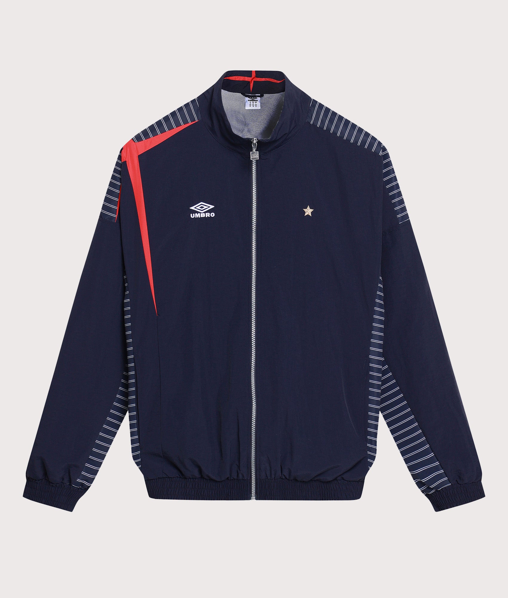 Umbro Relaxed Fit Track Jacket in Baritone Blue, Brilliant White and Goji B at EQVVS Menswear. Front shot.