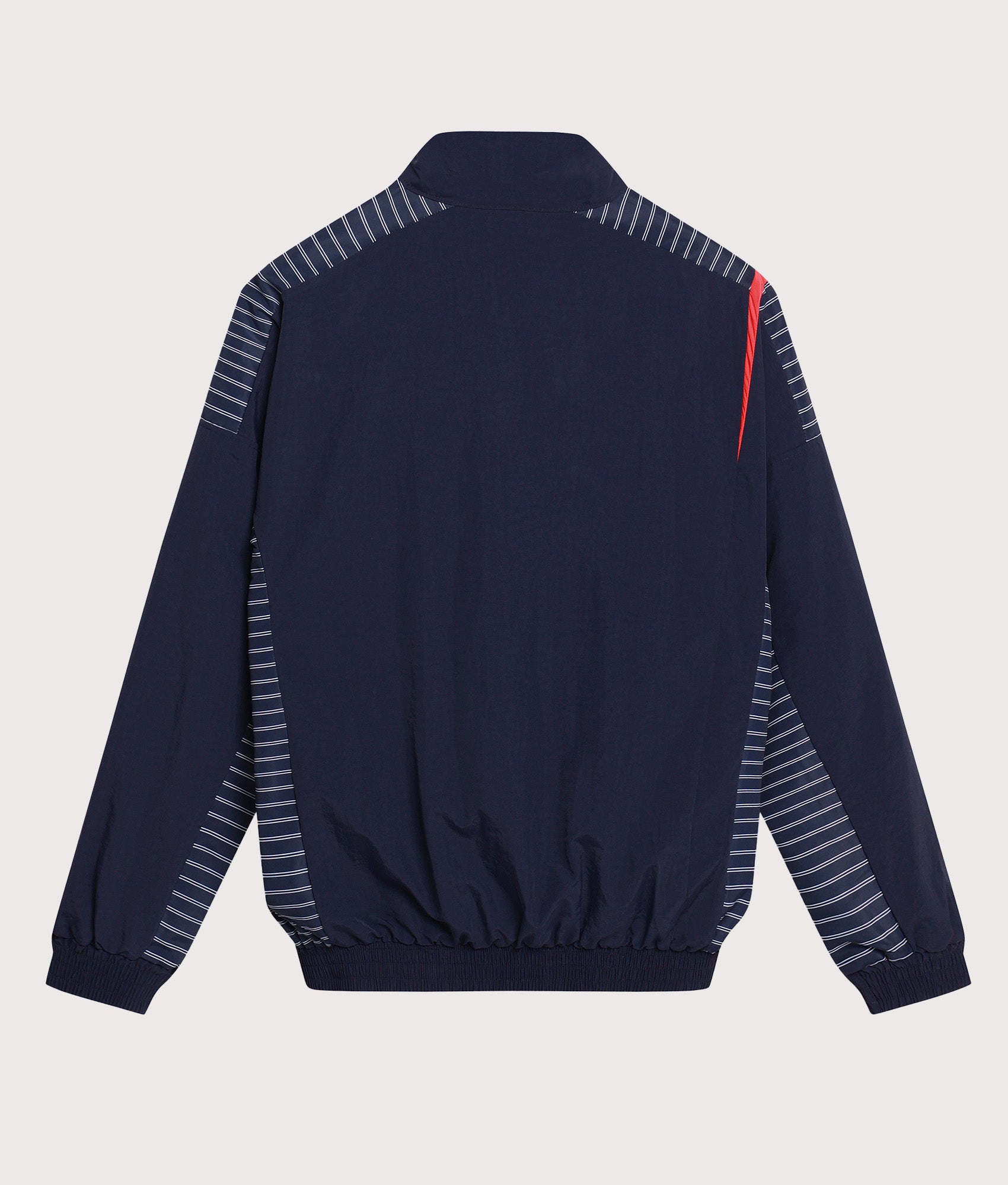Umbro Relaxed Fit Track Jacket in Baritone Blue, Brilliant White and Goji B at EQVVS Menswear. Back shot.