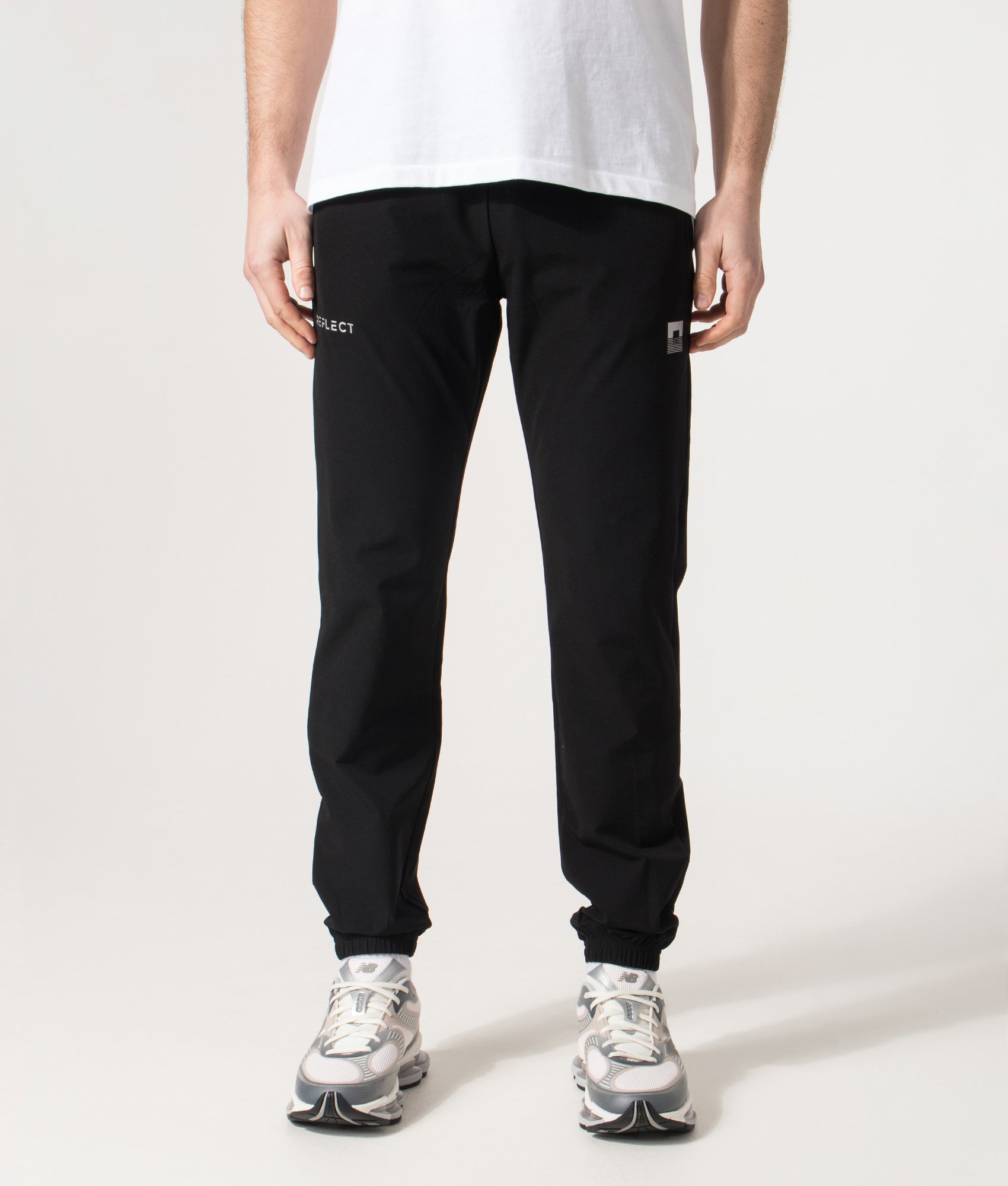 REFLECT Woven Track Pants in Black at EQVVS Menswear. Front shot. 