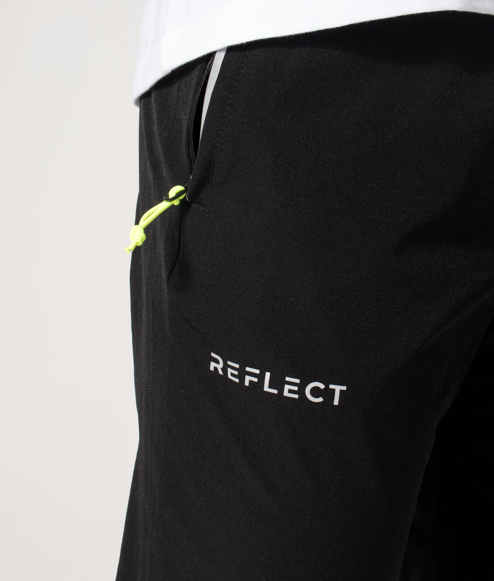 REFLECT Woven Track Pants in Black at EQVVS Menswear. Second detail shot.