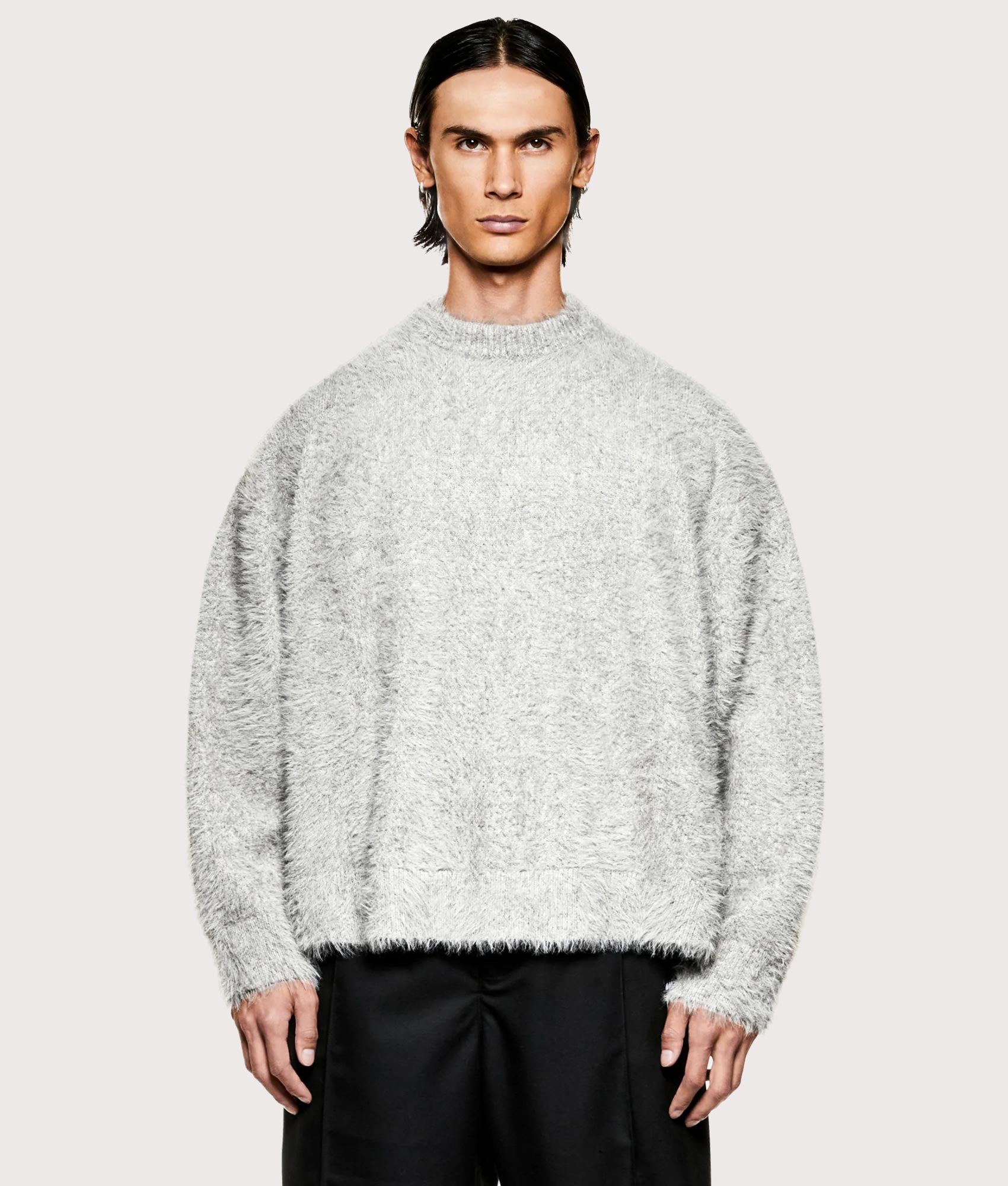 MKI MIYUKI ZOKU Faux Alpaca Knit Crewneck Jumper in Grey Melange at EQVVS Menswear. Model front shot. 