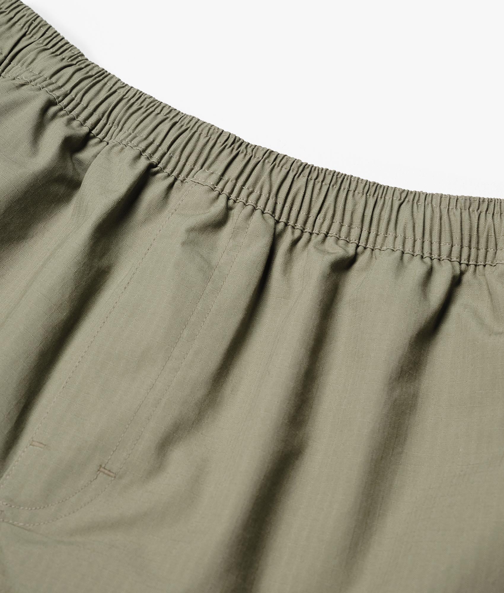 Relaxed Fit Ripstop Cargo Shorts in Sage Green by MKI MIYUKI ZOKU. EQVVS Detail Shot.