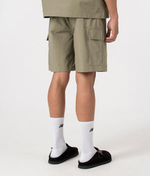 MKI Relaxed Fit Ripstop Cargo Shorts in Sage Green. Back angle model shot at EQVVS.