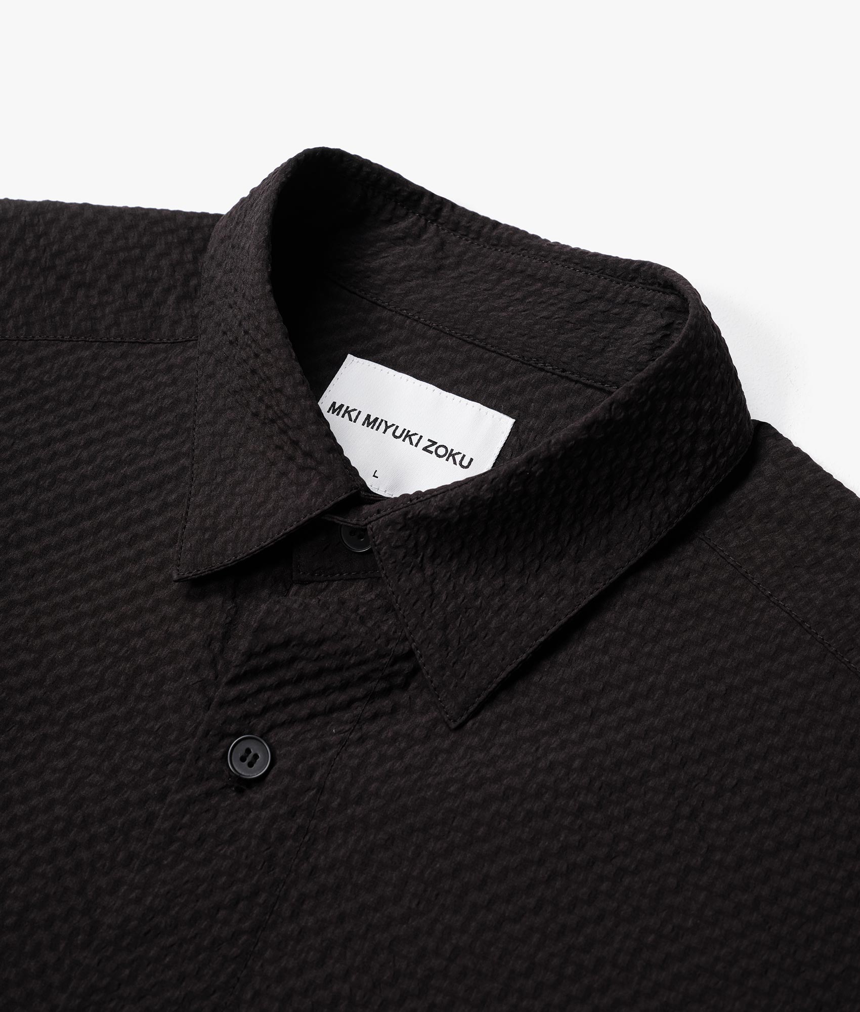 Oversized Seersucker Dress Shirt in Black by MKI MIYUKI ZOKU. EQVVS Detail Shot.