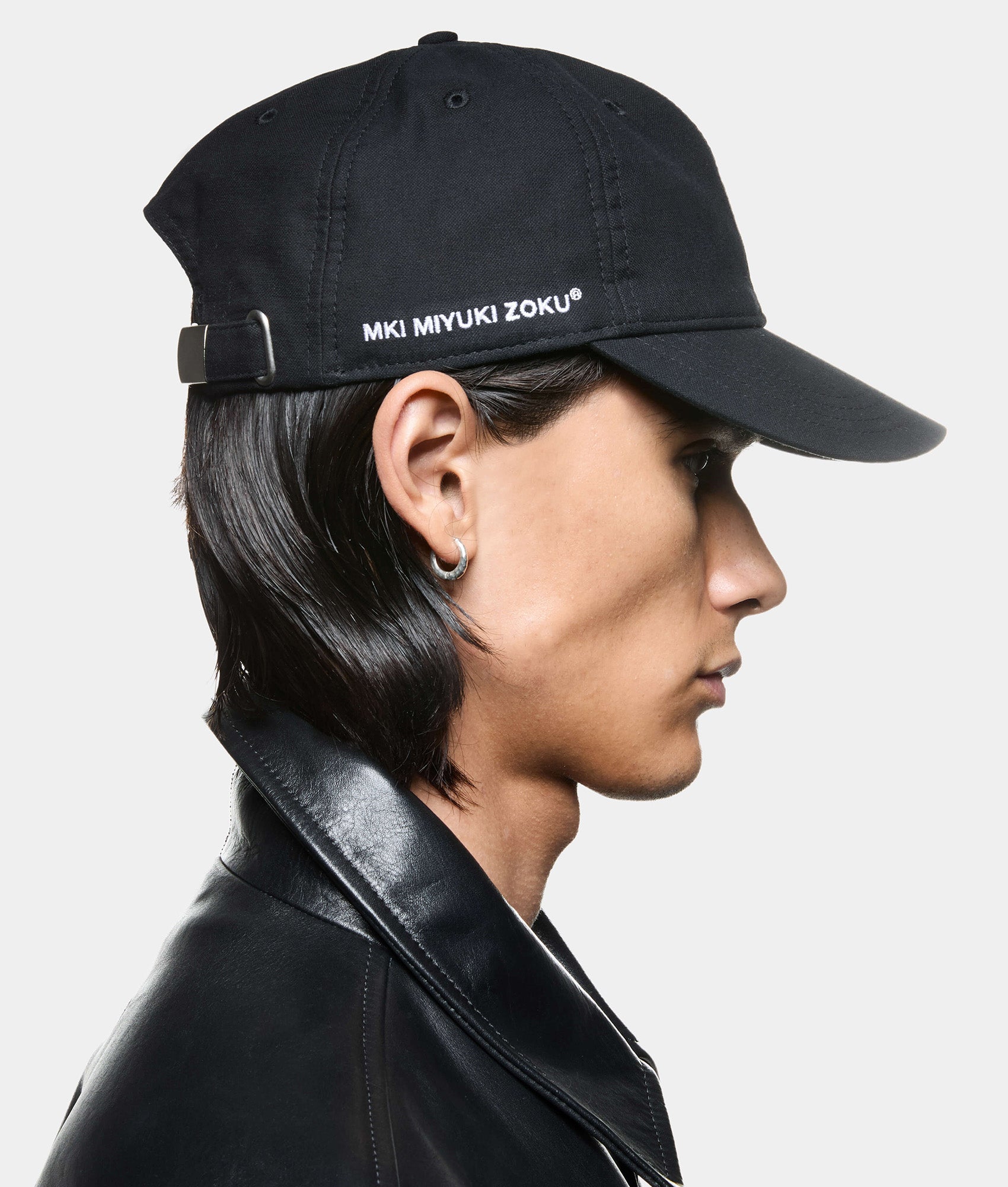 MKI MIYUKI ZOKU 6 Panel Cap in Black at EQVVS Menswear. Model side detail shot.