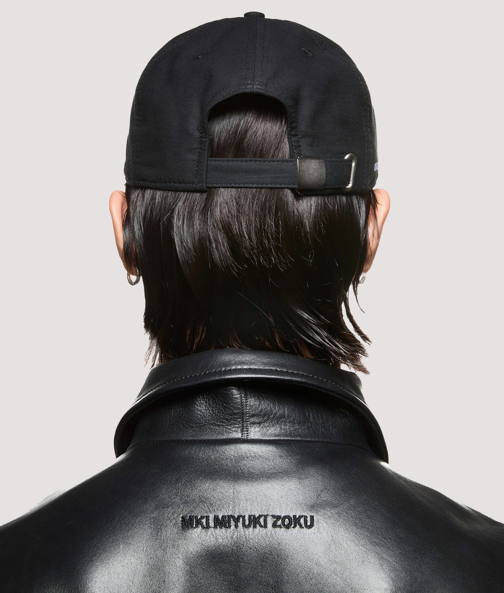 MKI MIYUKI ZOKU 6 Panel Cap in Black at EQVVS Menswear. Model back shot.