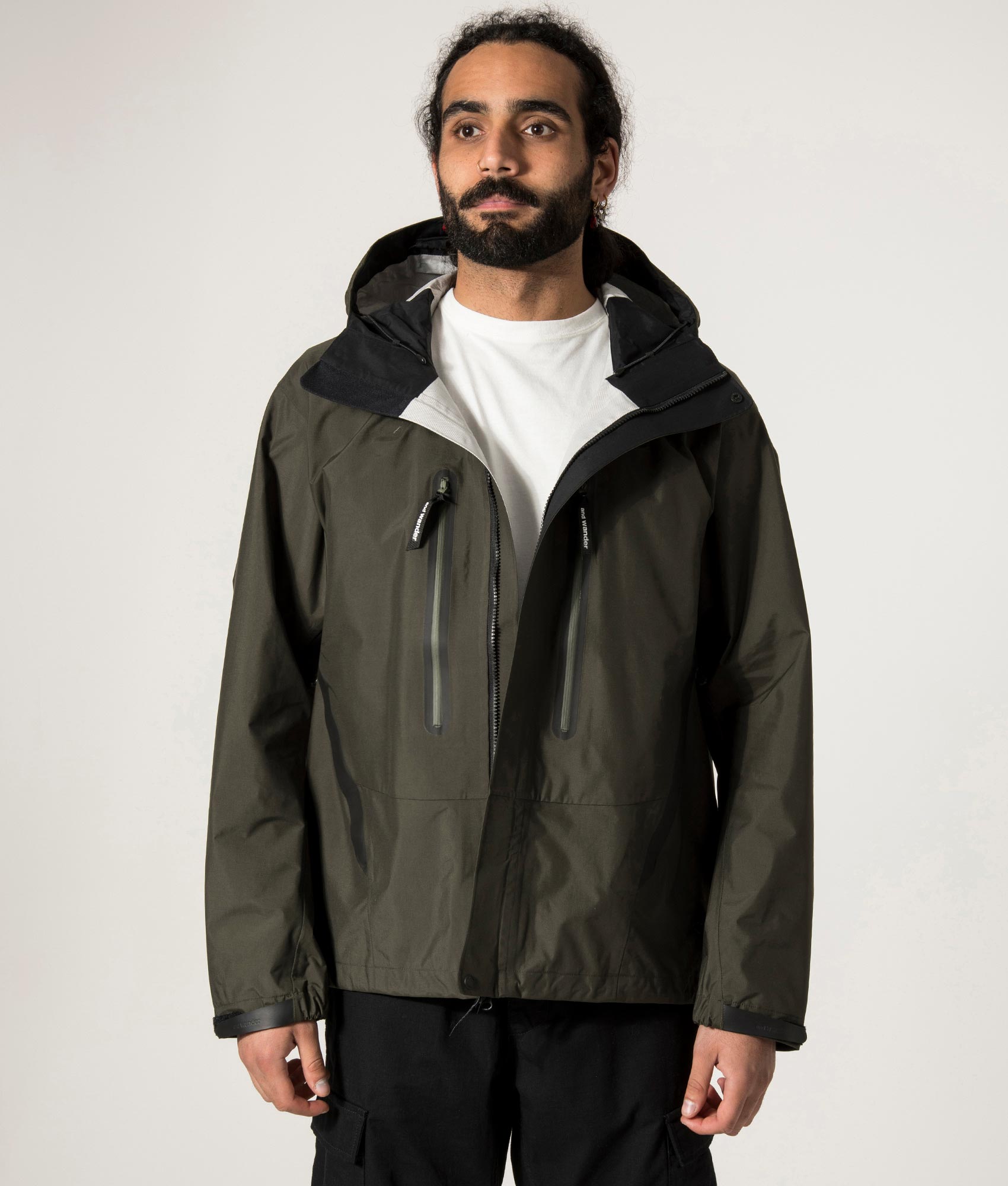 and wander 2.5L Hiker Rain Jacket in Dark Khaki. Open Jacket Model Shot at EQVVS