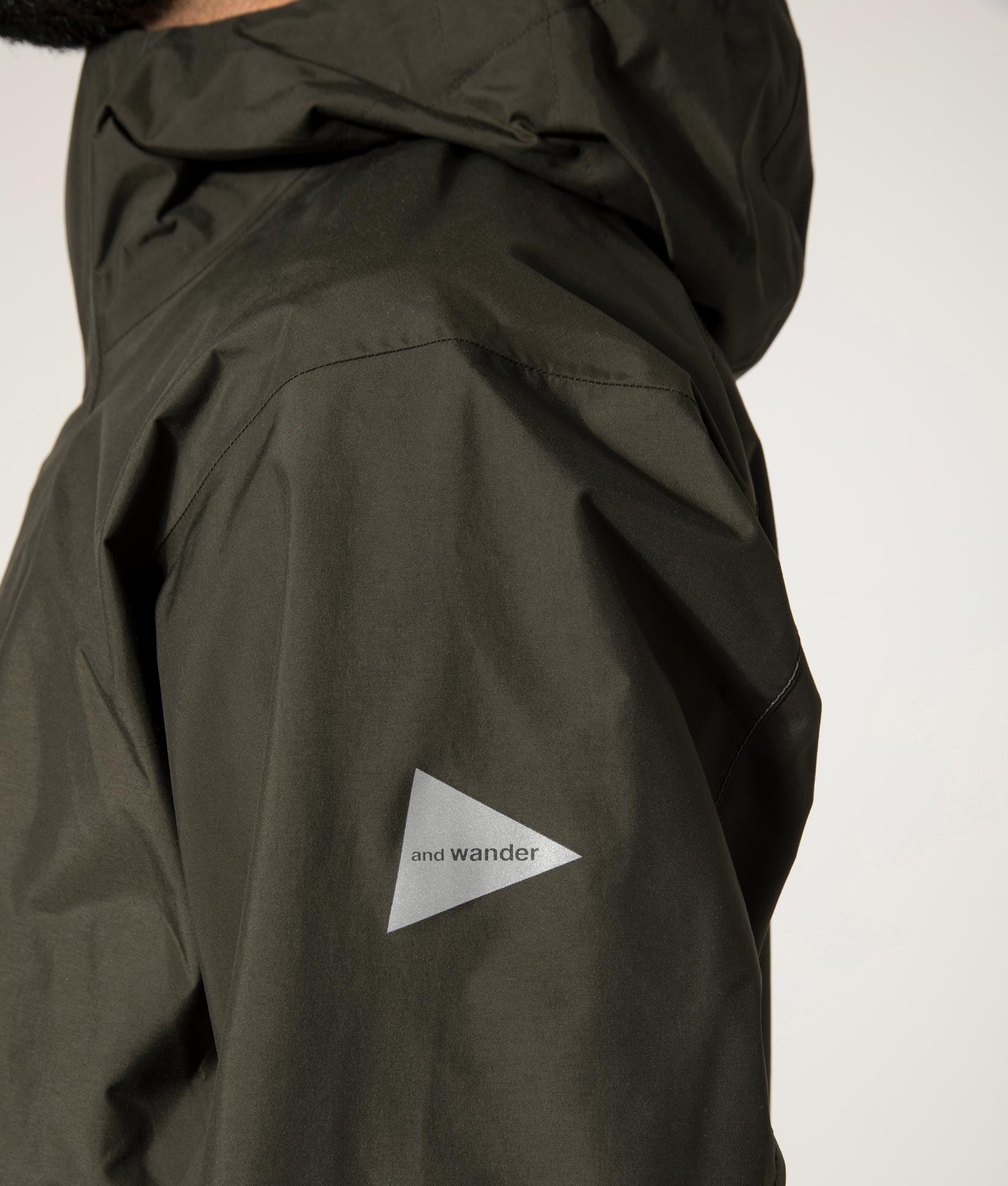 and wander 2.5L Hiker Rain Jacket in Dark Khaki. Detail Model Shot at EQVVS