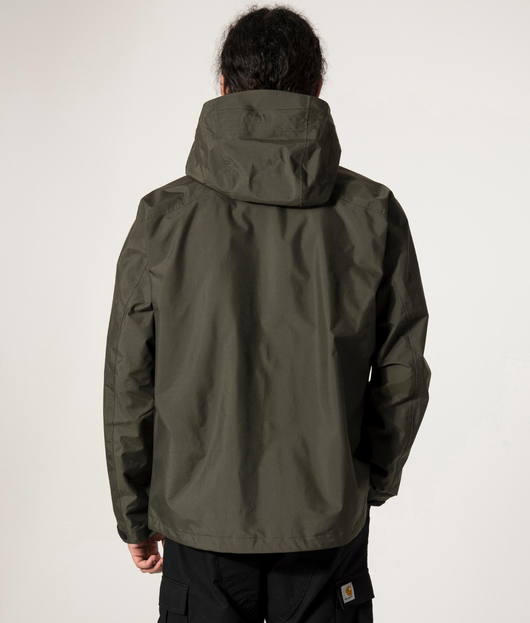 and wander 2.5L Hiker Rain Jacket in Dark Khaki. Back Model Shot at EQVVS