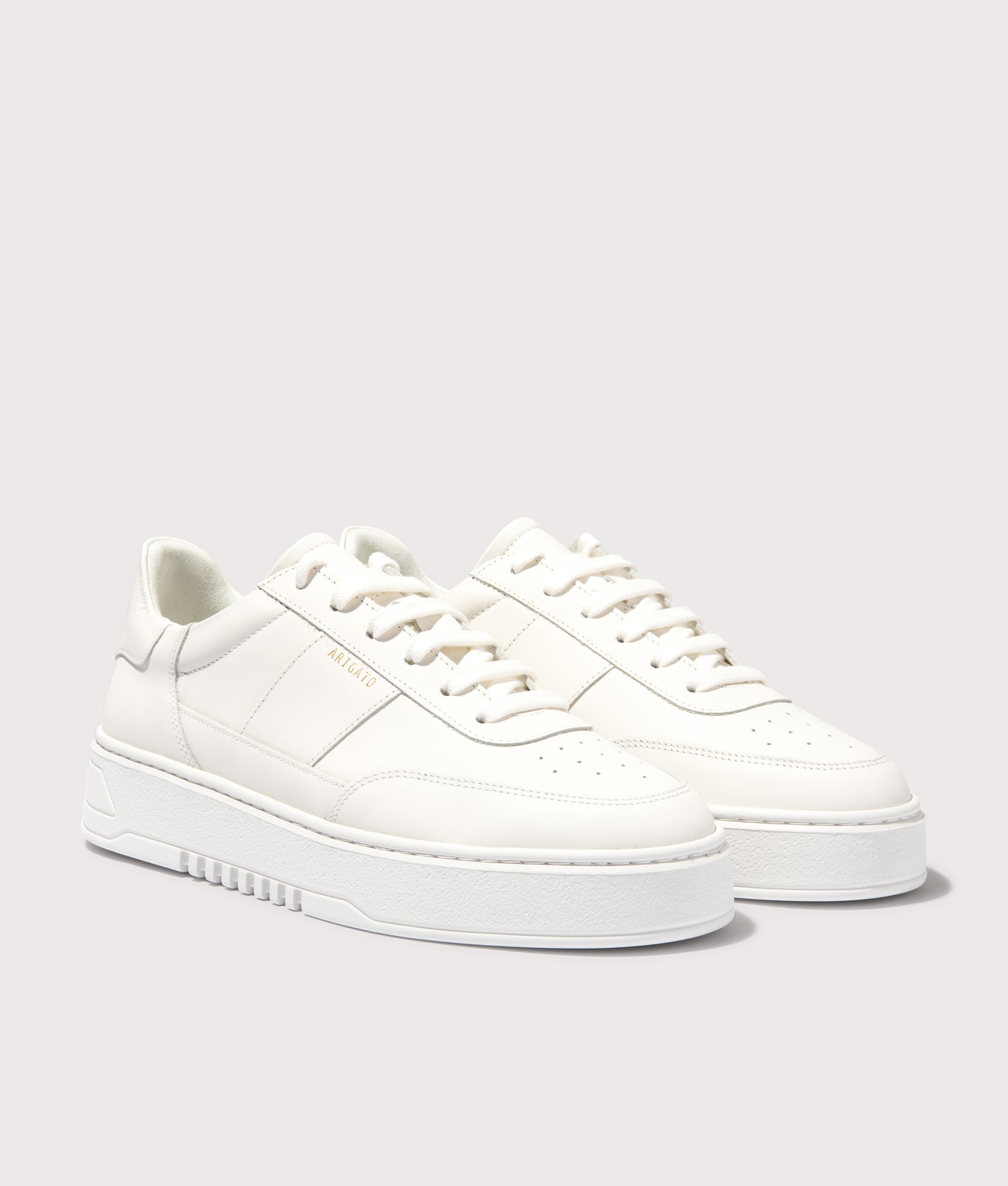 Axel Arigato Orbit Vintage Sneakers in White/White. Shot at EQVVS.  Front shot. 