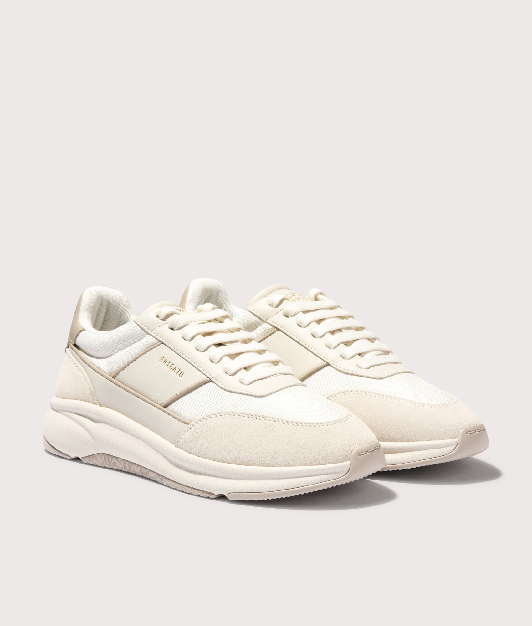 Axel Arigato Genesis Neo Sneakers in Off White/Off White. Shot at EQVVS.  Front shot. 
