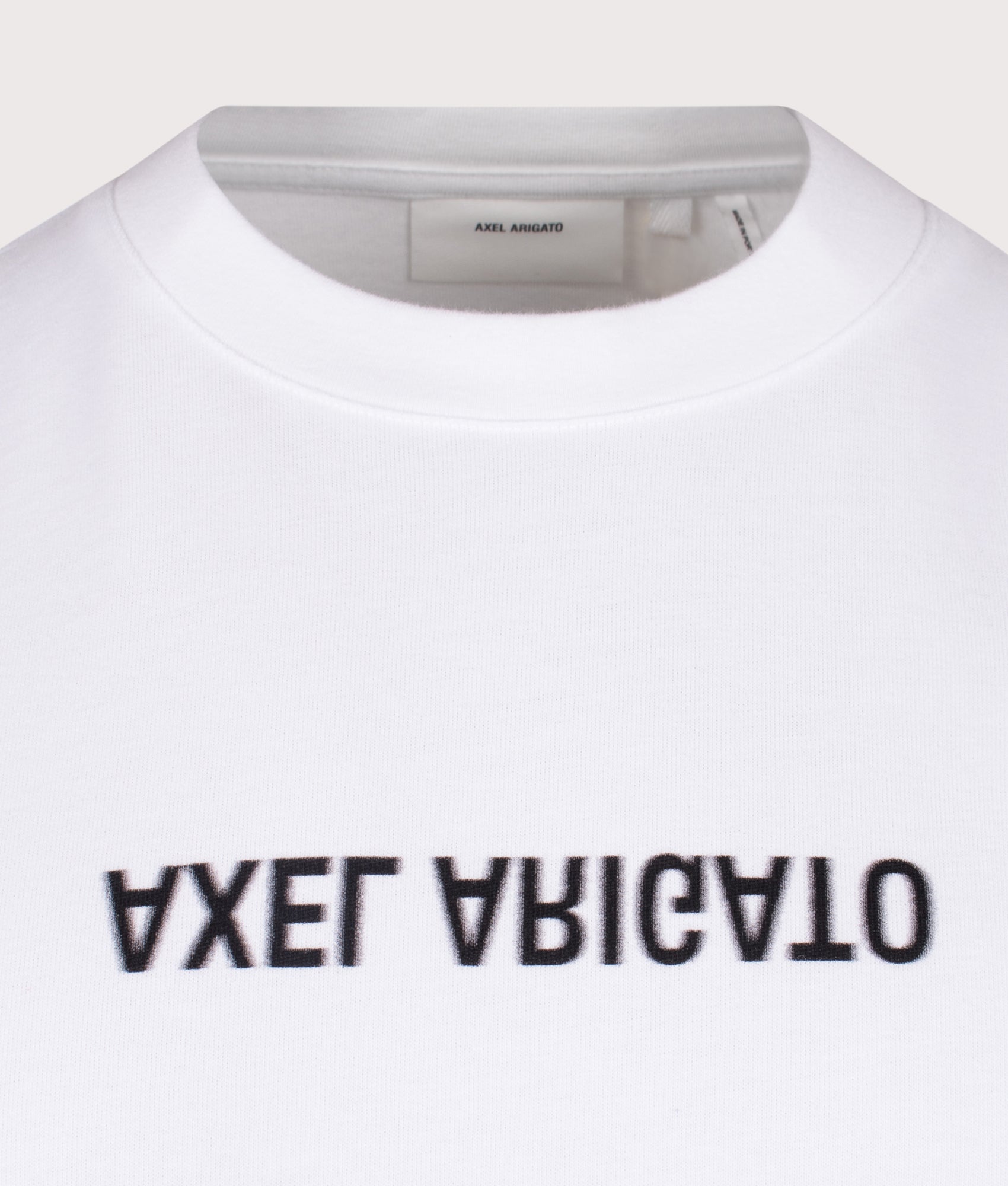 Axel Arigato Distort T-Shirt in White at EQVVS Menswear. Detail shot.
