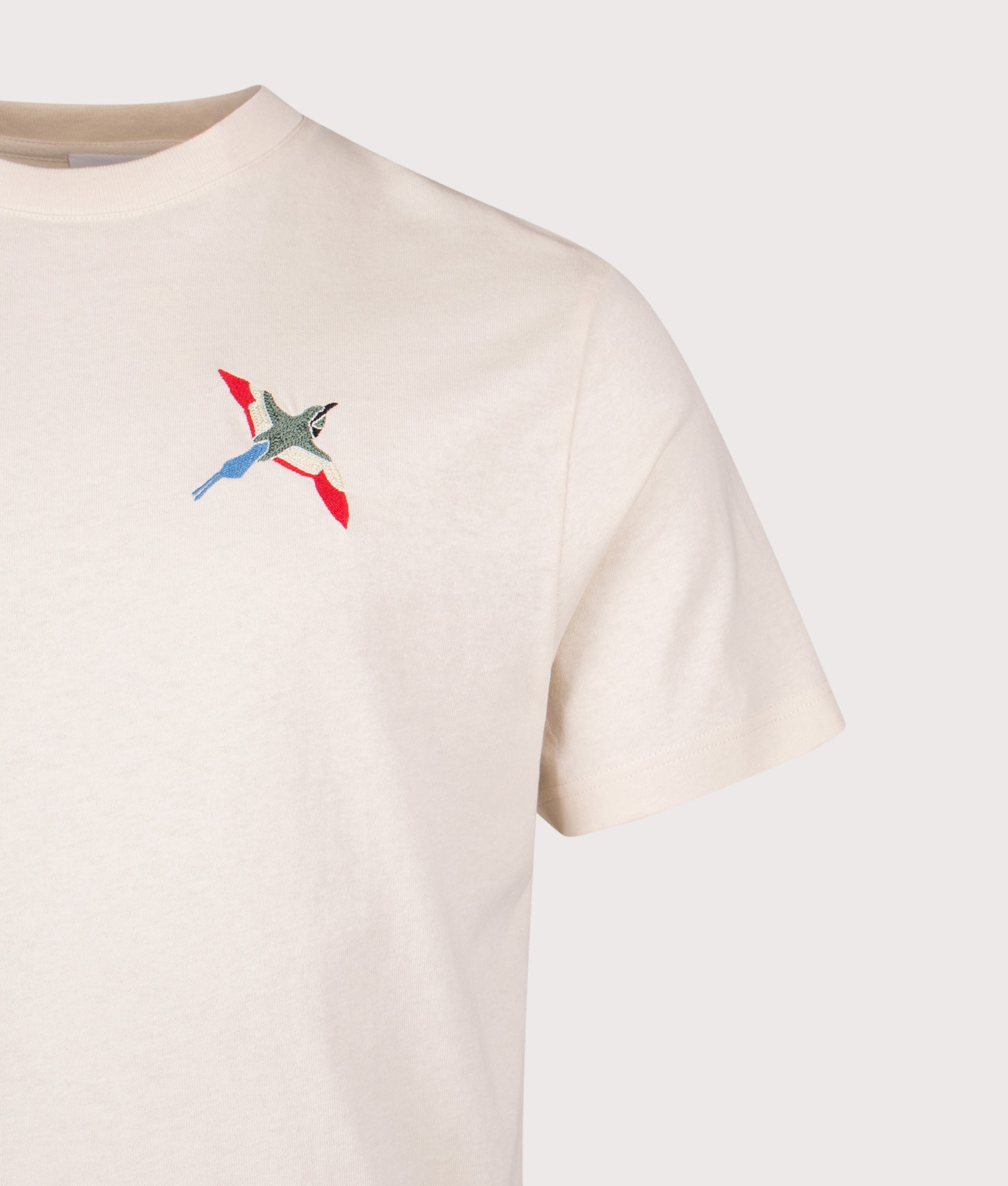Micro Bee Bird T-Shirt by Axel Arigato in Pale Beige. Short by EQVVS. Detail shot.