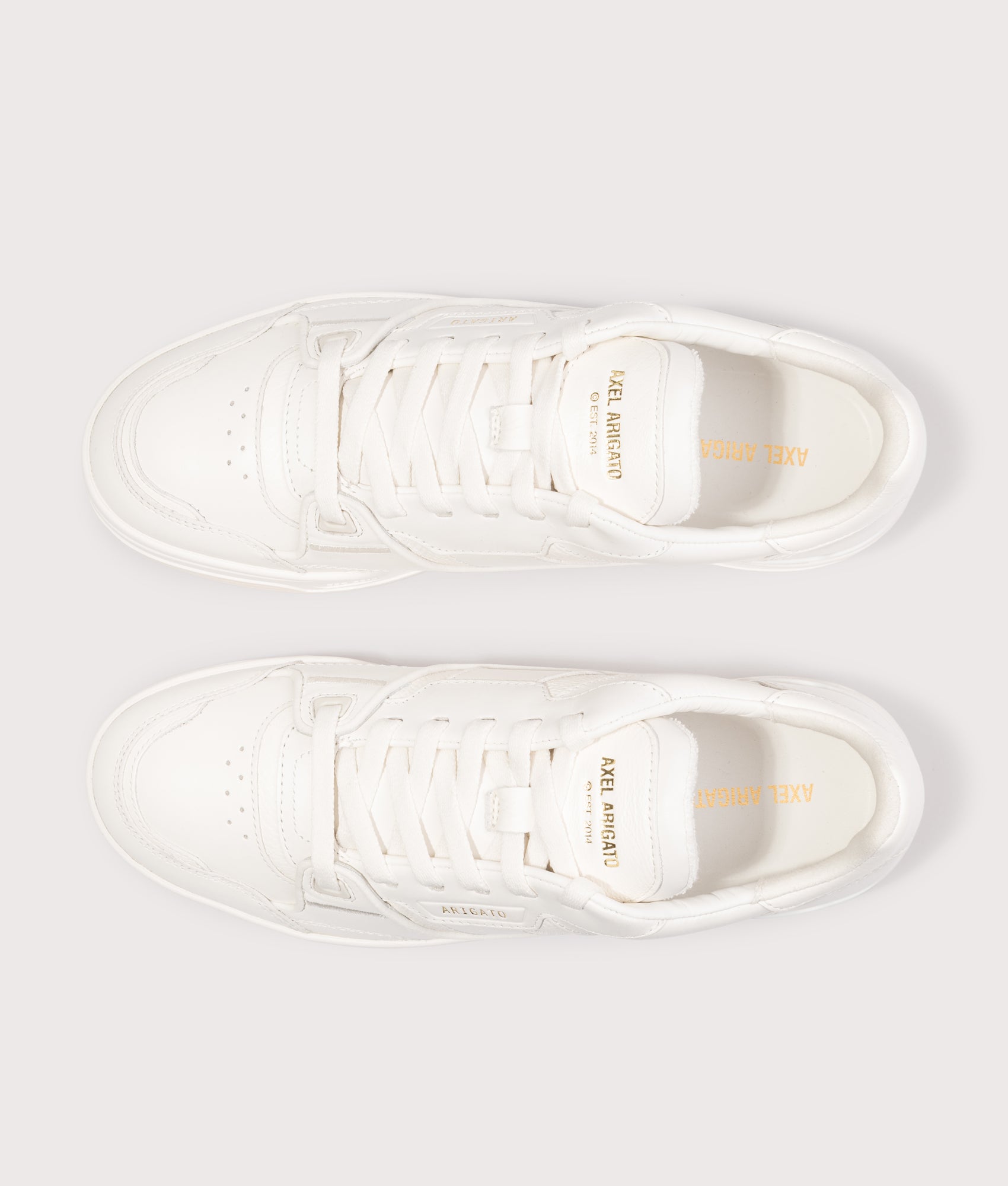 Axel Arigato Clay sneakers in Off White at EQVVS Menswear. Top shot.