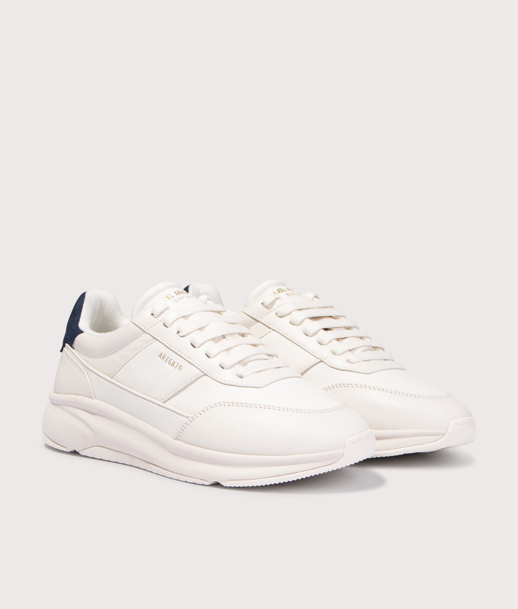 Genesis Neo Leather Runners by Axel Arigato in Off White. Shot by EQVVS. Front detail shot.