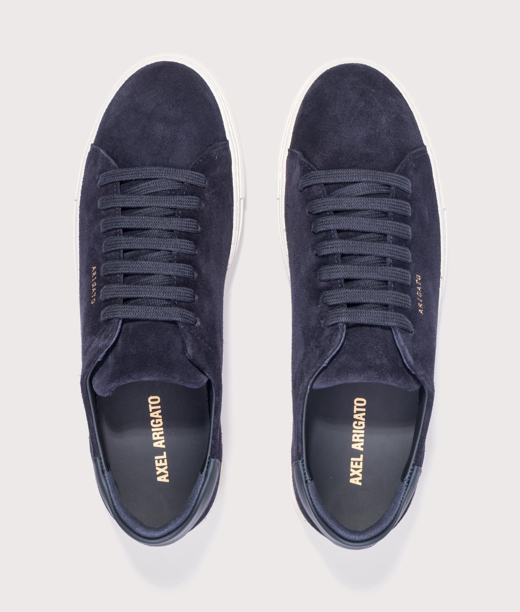 Axel Arigato Clean 90 Suede Sneakers in Dark Blue and Off White at EQVVS Menswear. Top shot.