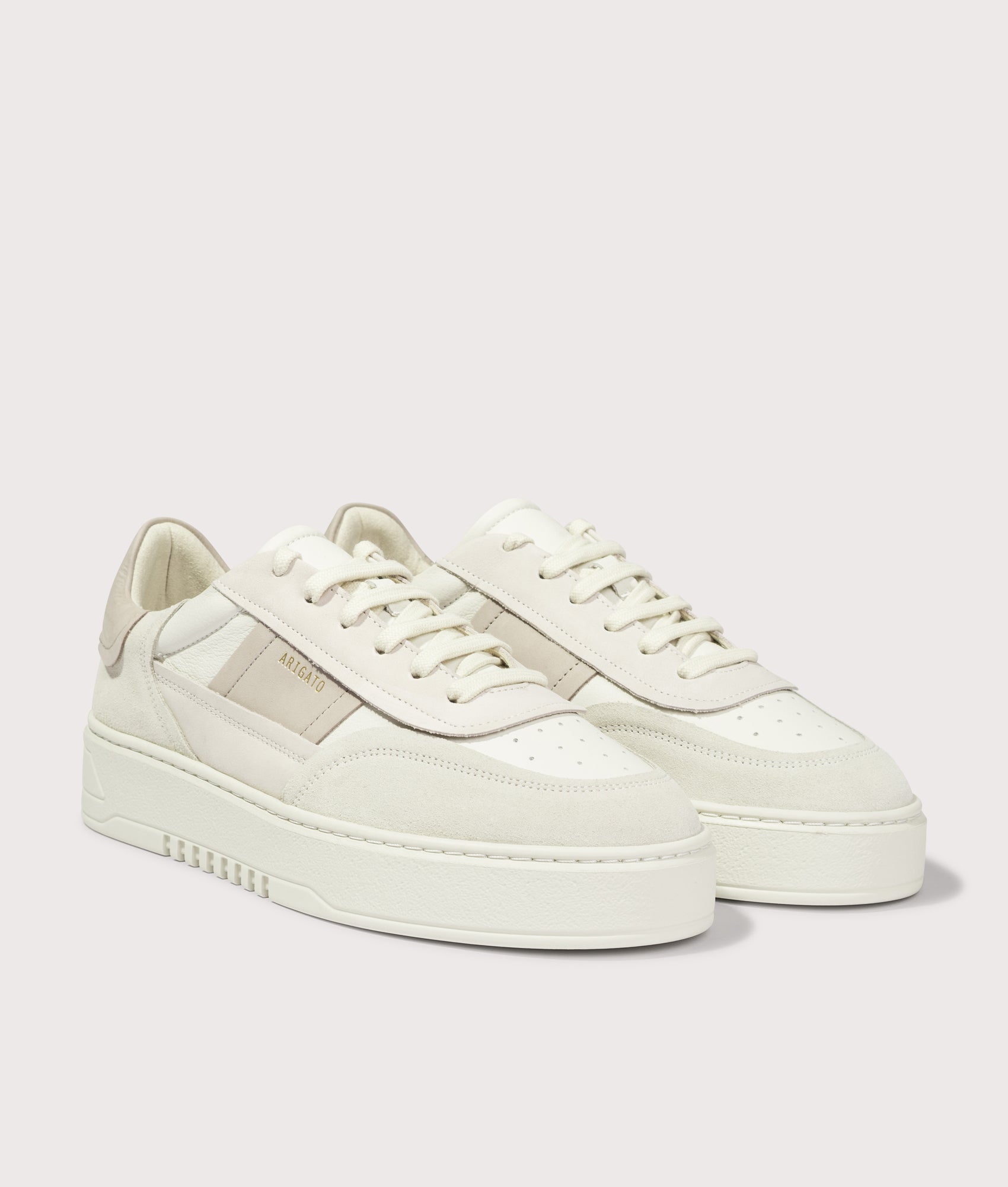Axel Arigato Orbit Edge sneaker in Light Beige and Light Taupe at EQVVS Menswear. Angled front shot.