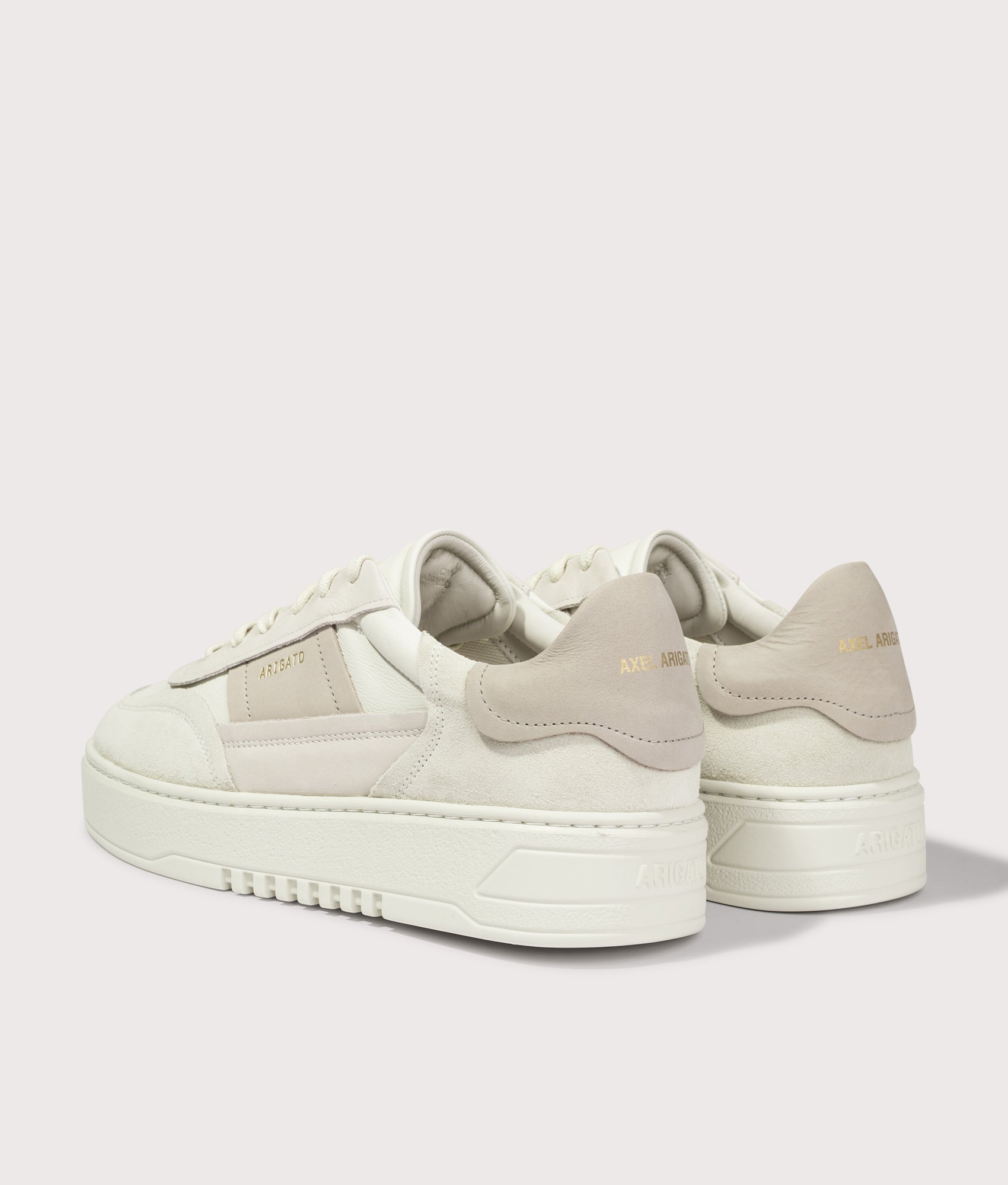 Axel Arigato Orbit Edge sneaker in Light Beige and Light Taupe at EQVVS Menswear. Angled back shot.