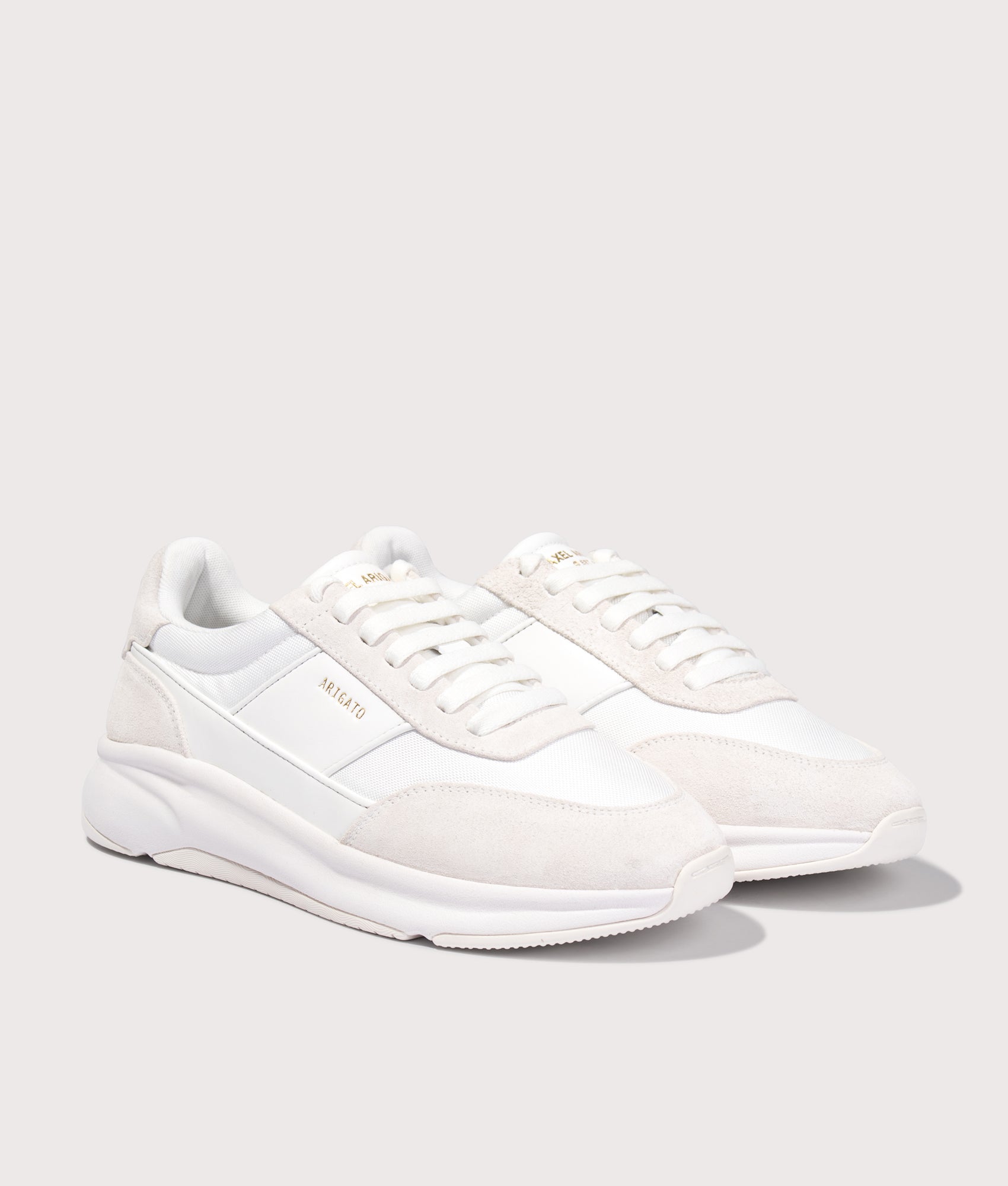 Axel Arigato Genesis Neo Runners in White/White at EQVVS Menswear. Angled front shot.