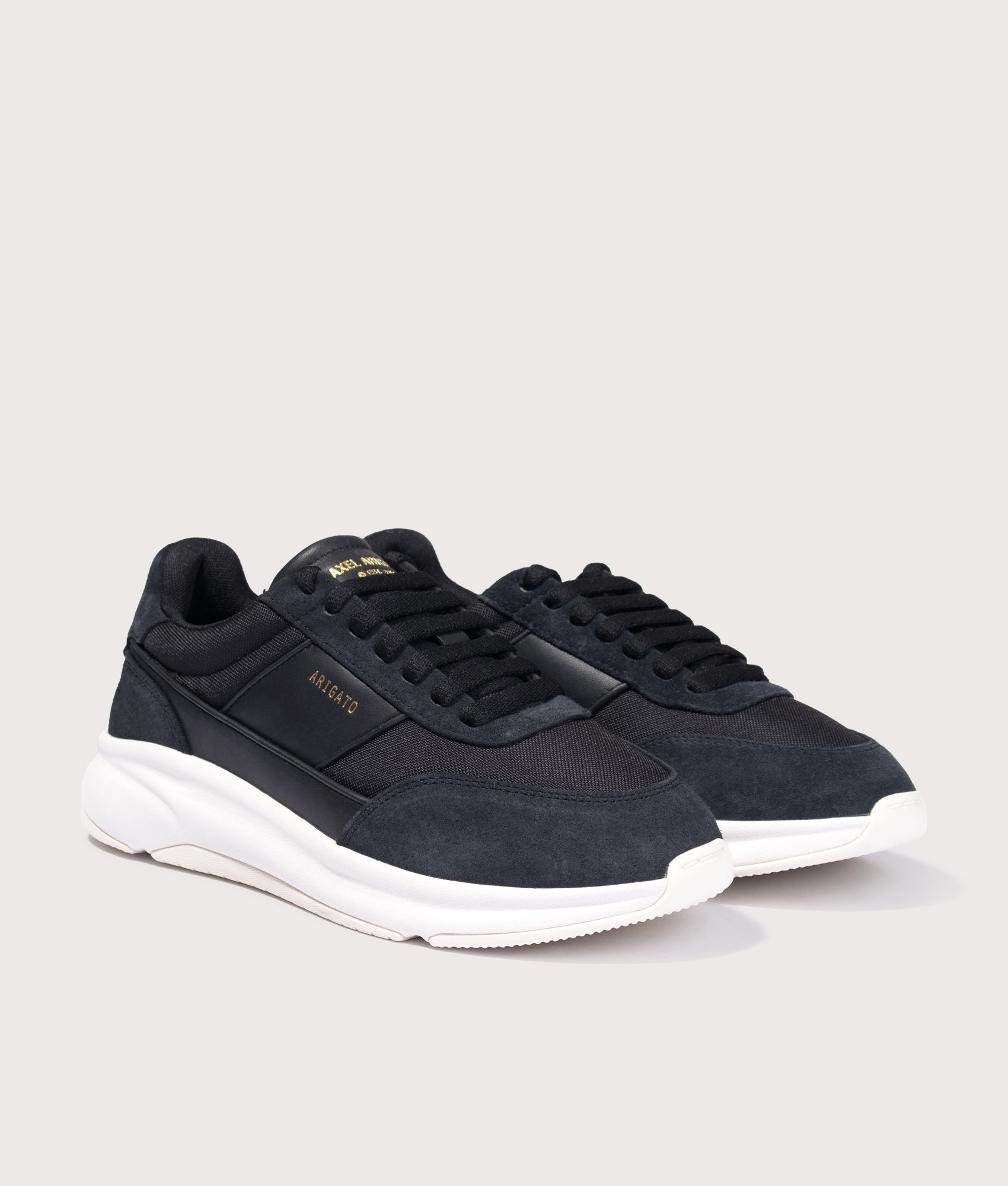 Axel Arigato Genesis Neo Runners in Black/White at EQVVS Menswear. Angled front shot.