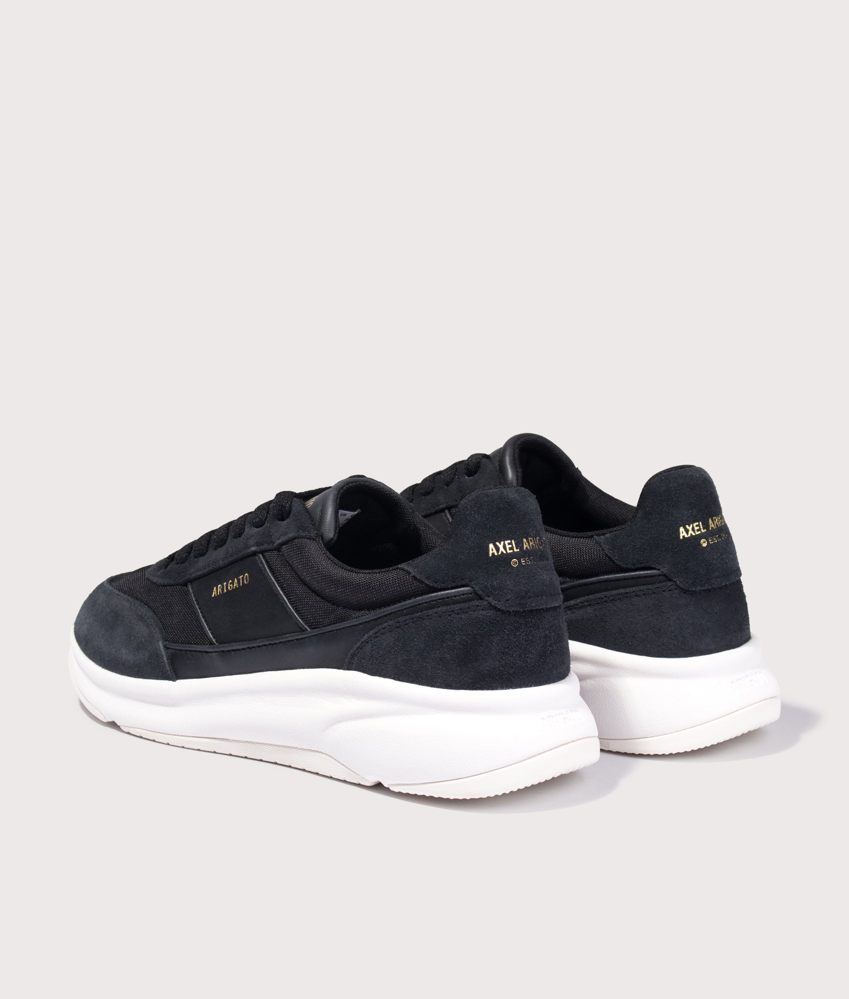 Axel Arigato Genesis Neo Runners in Black/White at EQVVS Menswear. Angled back shot.