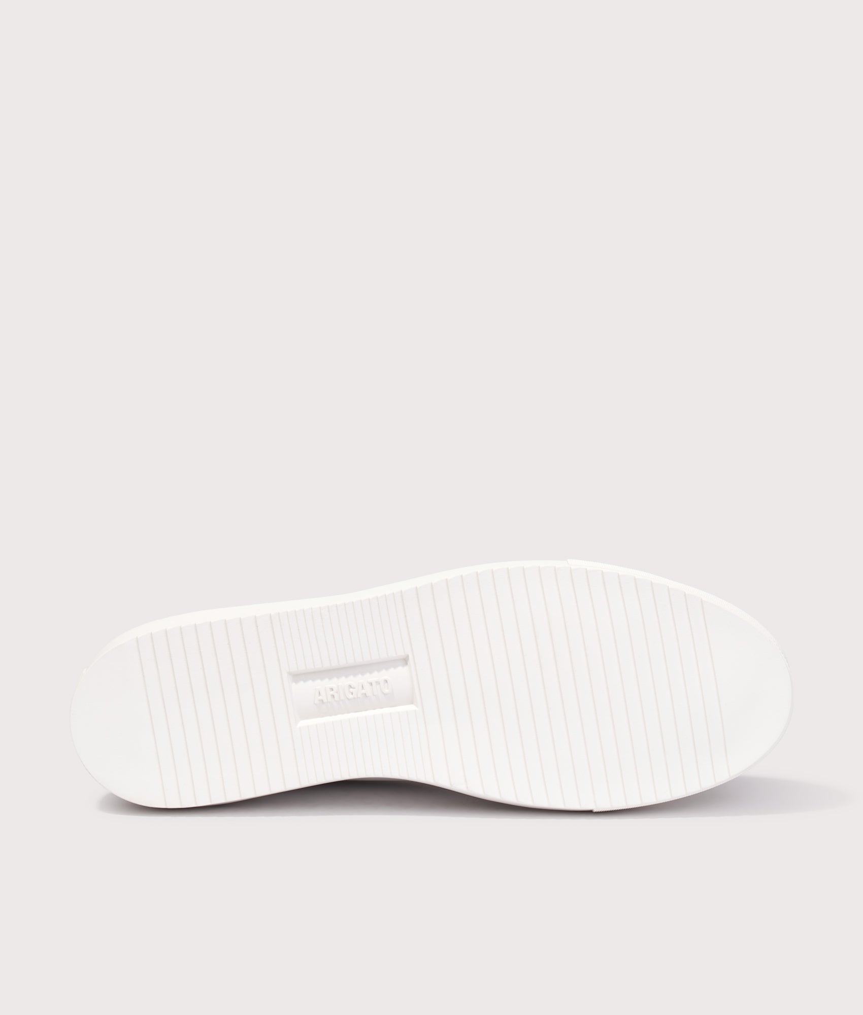 Axel Arigato Clean 90 Triple Sneakers in White/Grey at EQVVS Menswear. Tread shot.