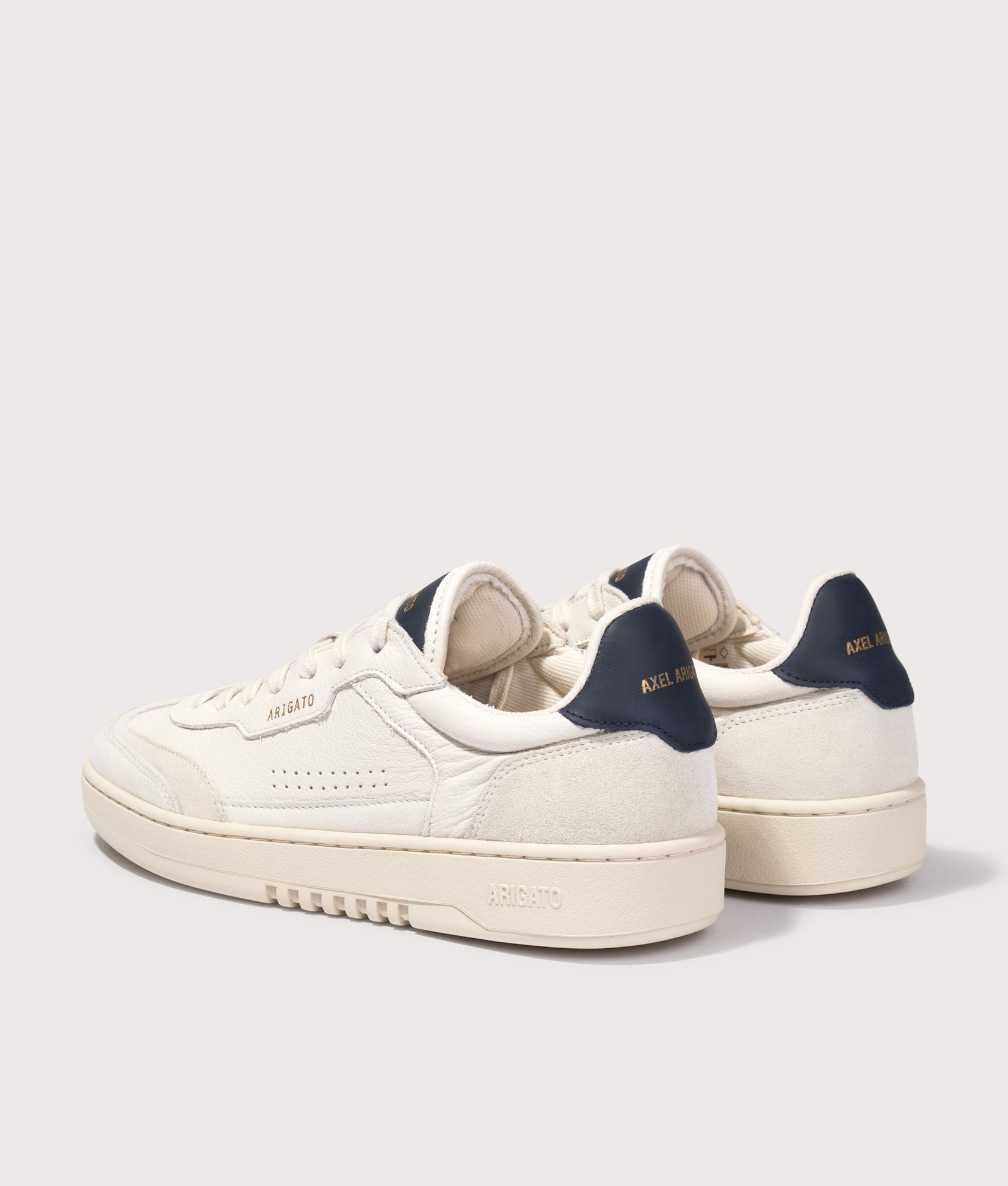 Axel Arigato Dice T-Toe Sneakers in Light Beige and Dark Blue at EQVVS Menswear. Angled back shot.