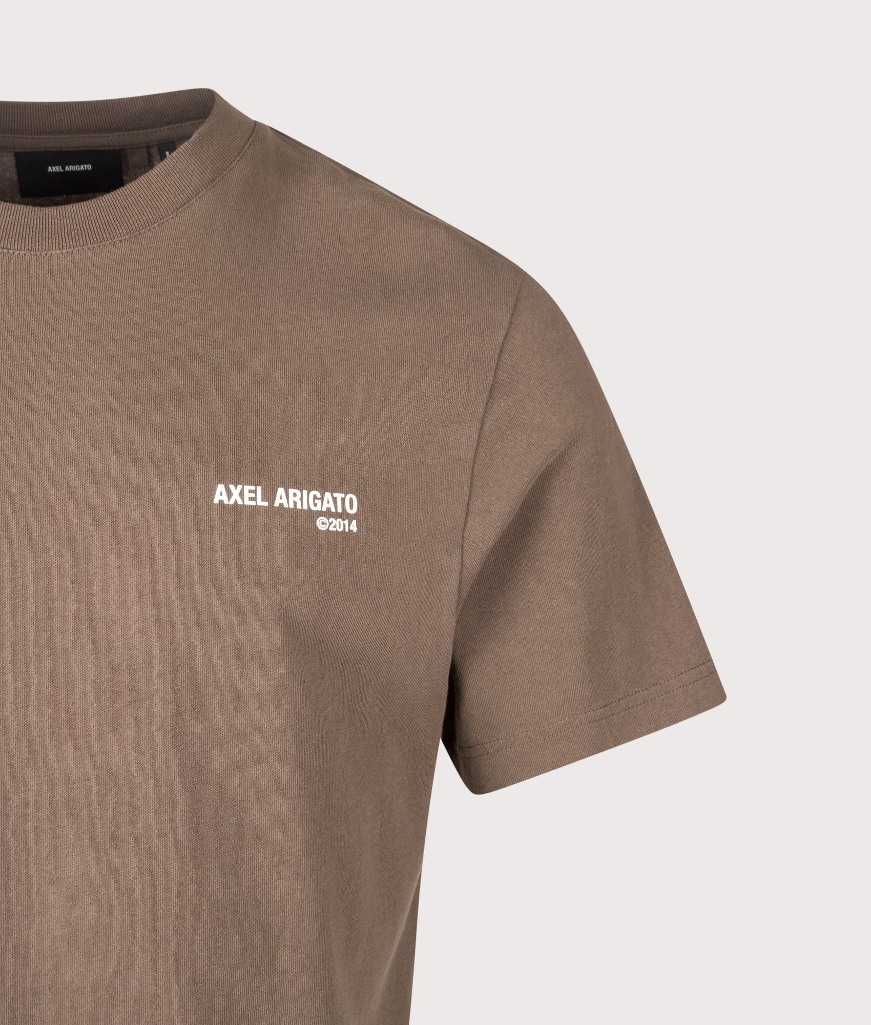 Axel Arigato Relaxed Fit Legacy T-Shirt in Coffee Brown at EQVVS Menswear. Detail shot.