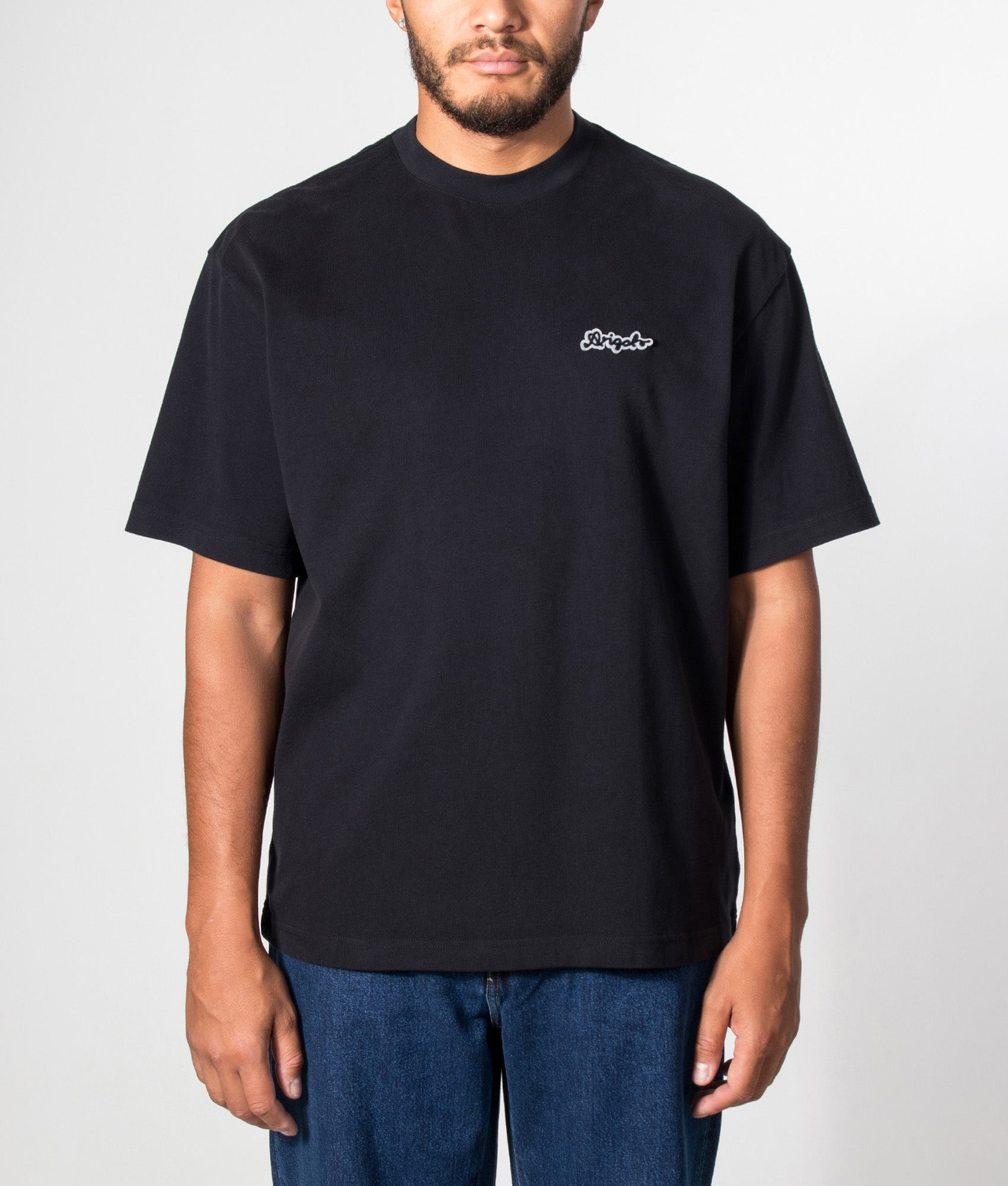 Axel Arigato Oversized Fit Trace T-Shirt in Black at EQVVS Menswear. Model front shot.