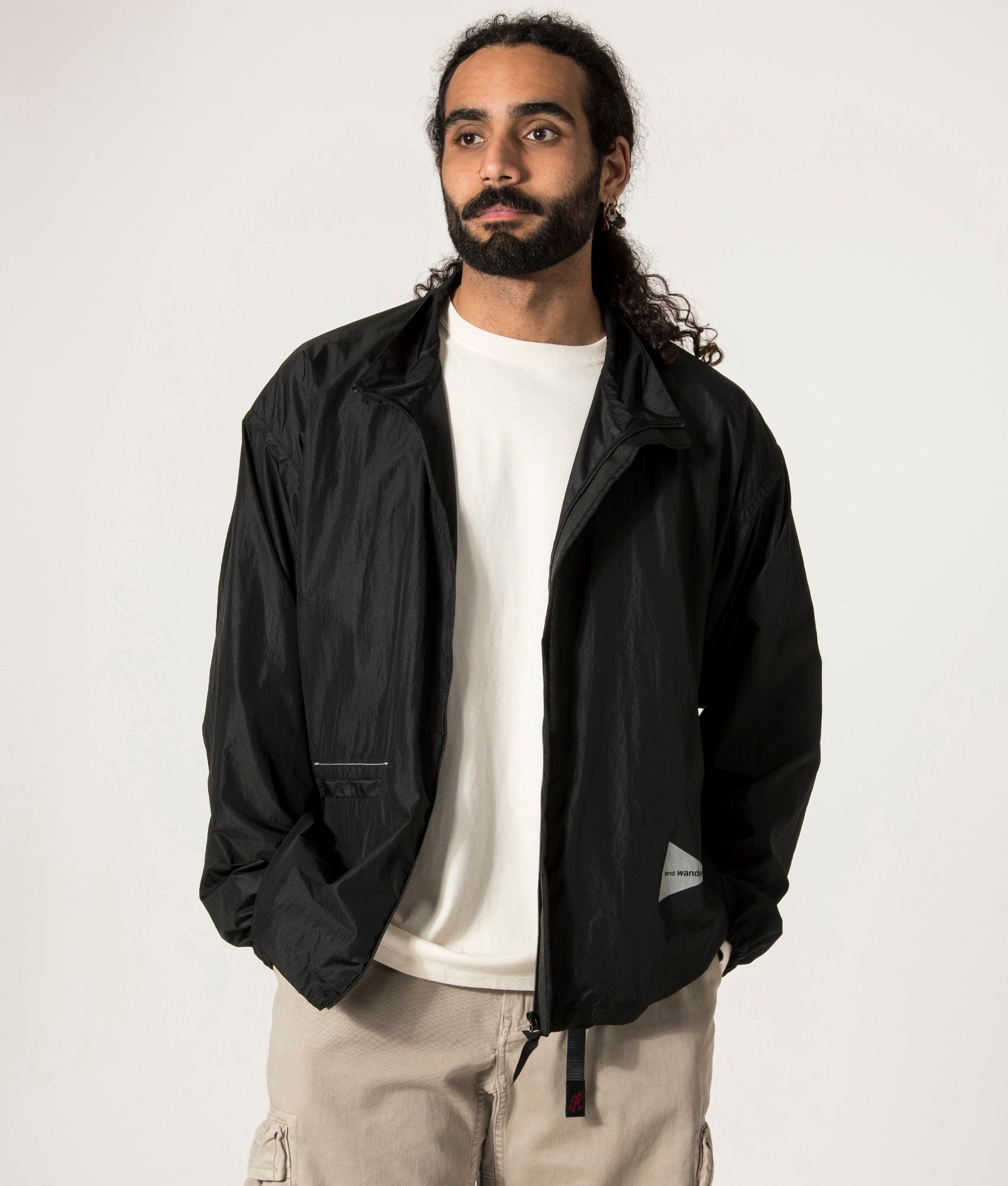 and Wander Oversized Rip Jacket in Black. Shot at EQVVS. Open Jacket Model Shot.