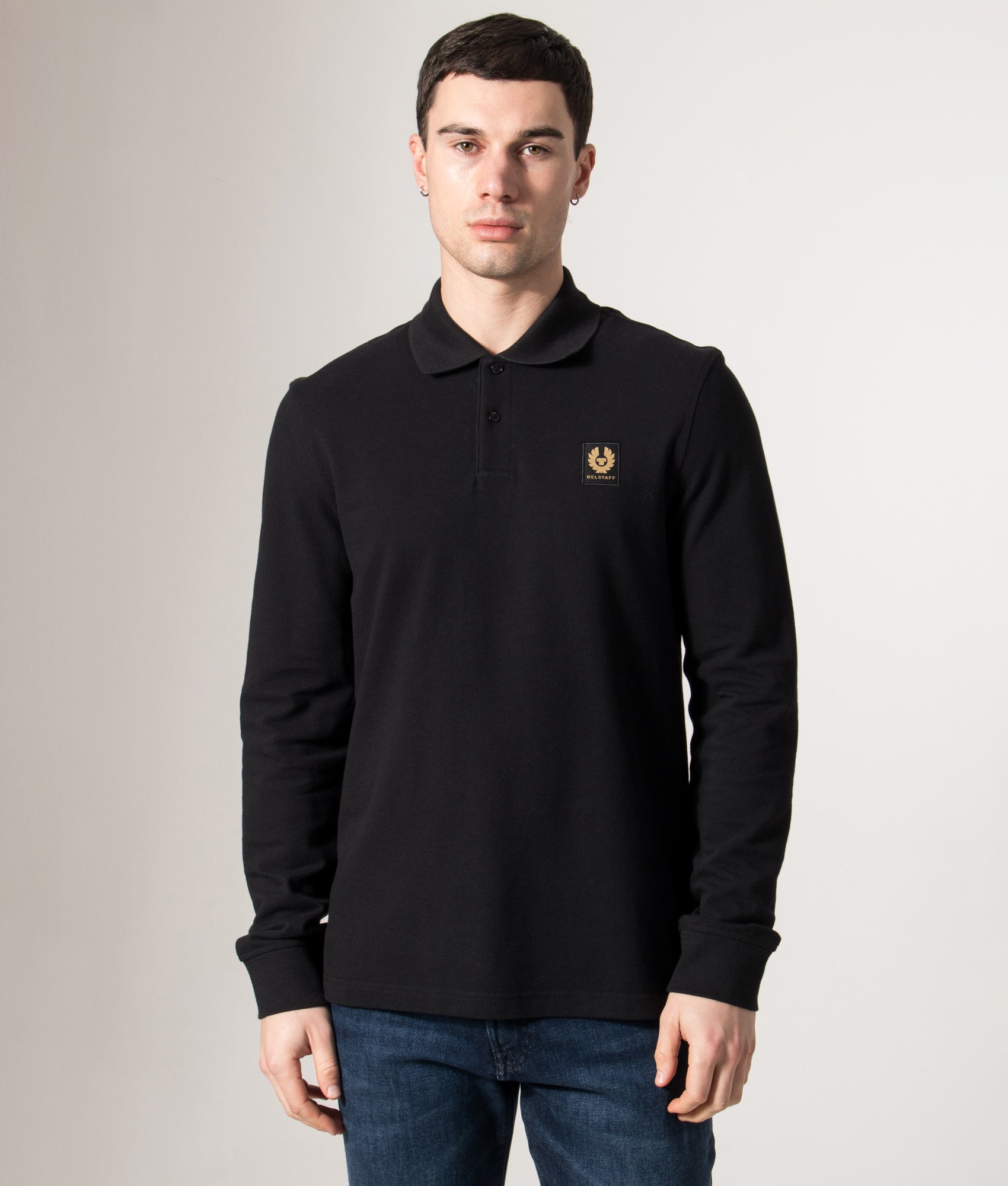 Belstaff Long Sleeve Polo Shirt in Black at EQVVS Menswear. Model front shot.