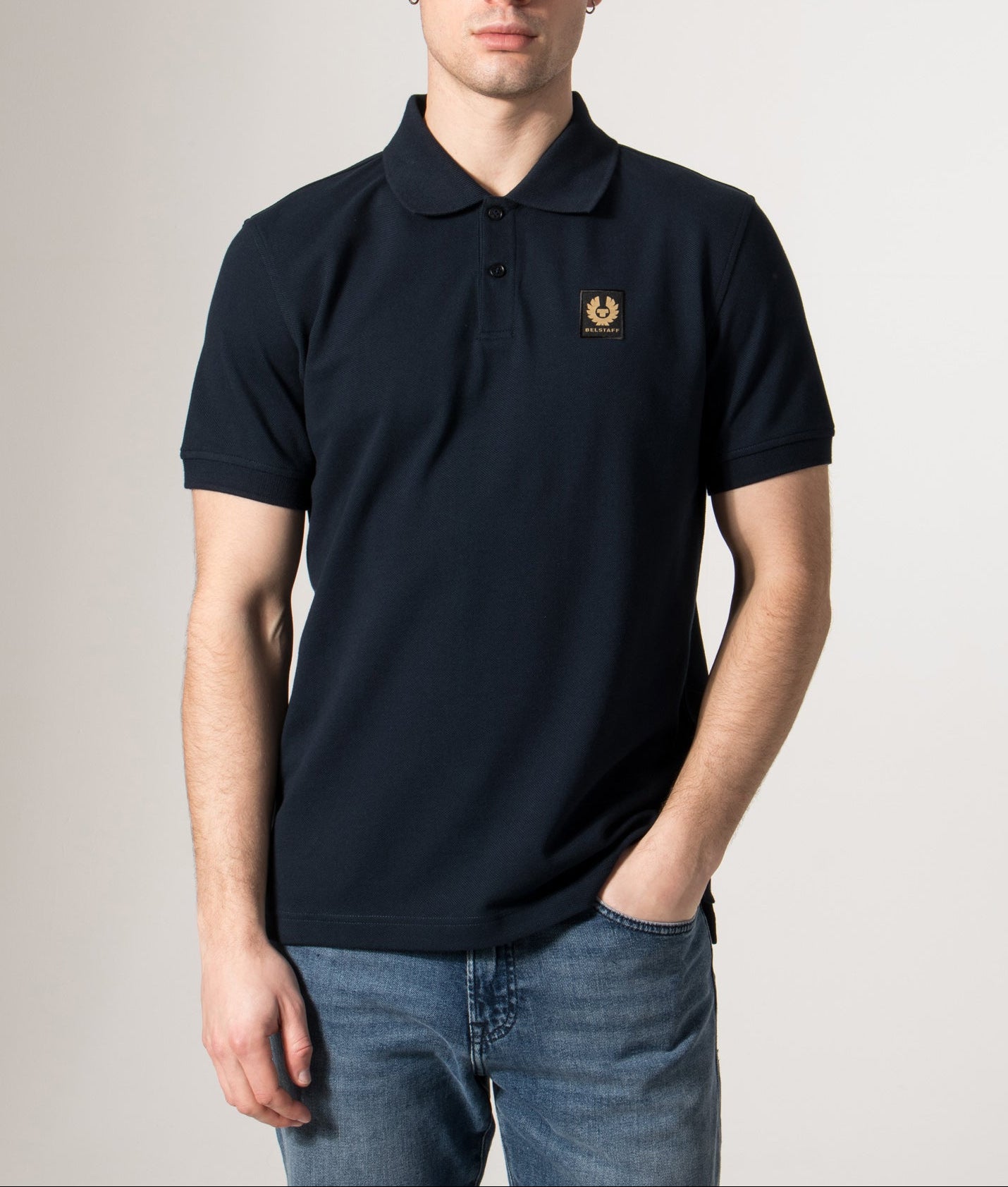 Belstaff Polo Shirt in Dark Ink Blue at EQVVS Menswear. Model front shot.