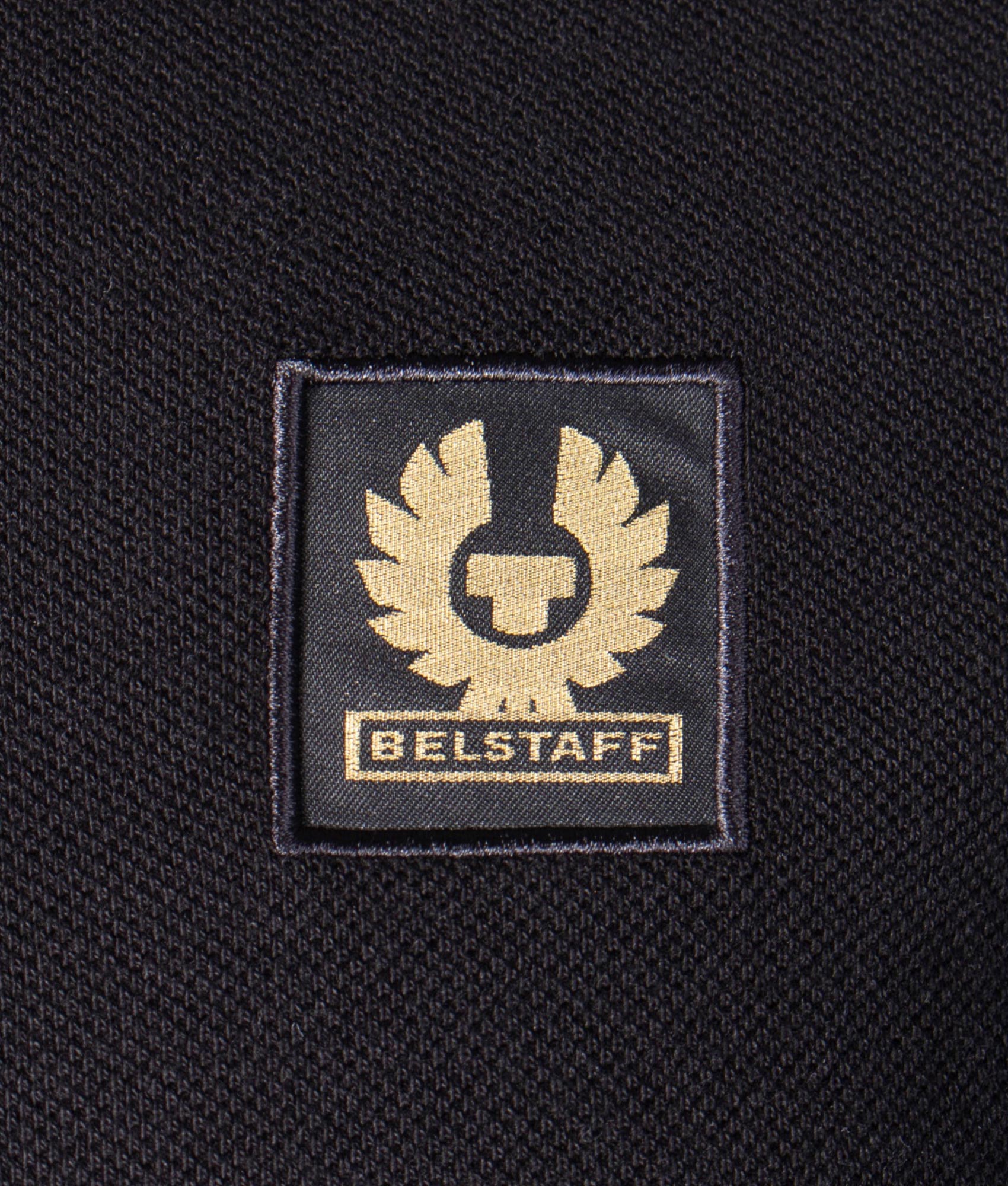Belstaff Polo Shirt in Black at EQVVS Menswear. Detail shot.