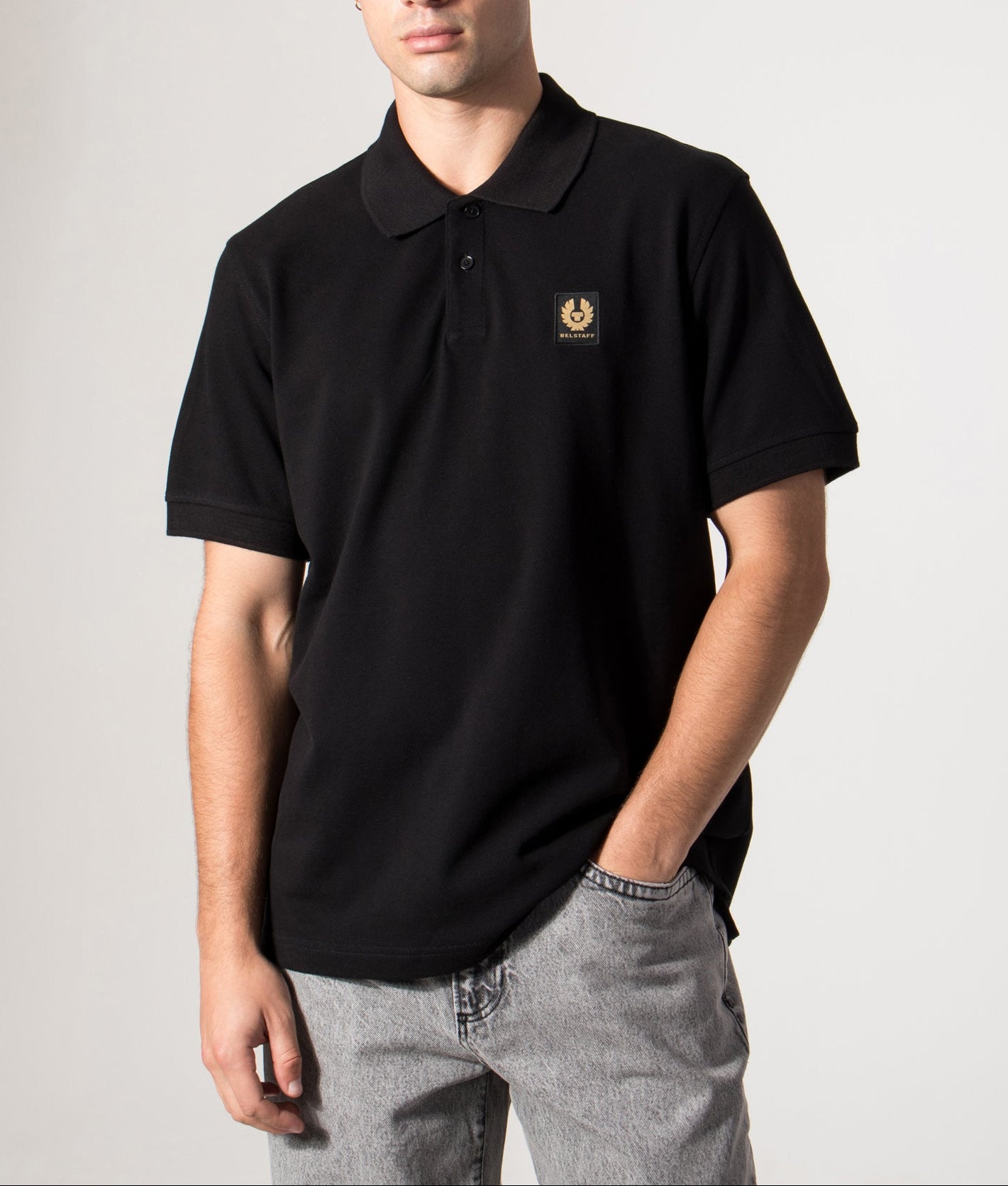 Belstaff Polo Shirt in Black at EQVVS Menswear. Model Front shot.