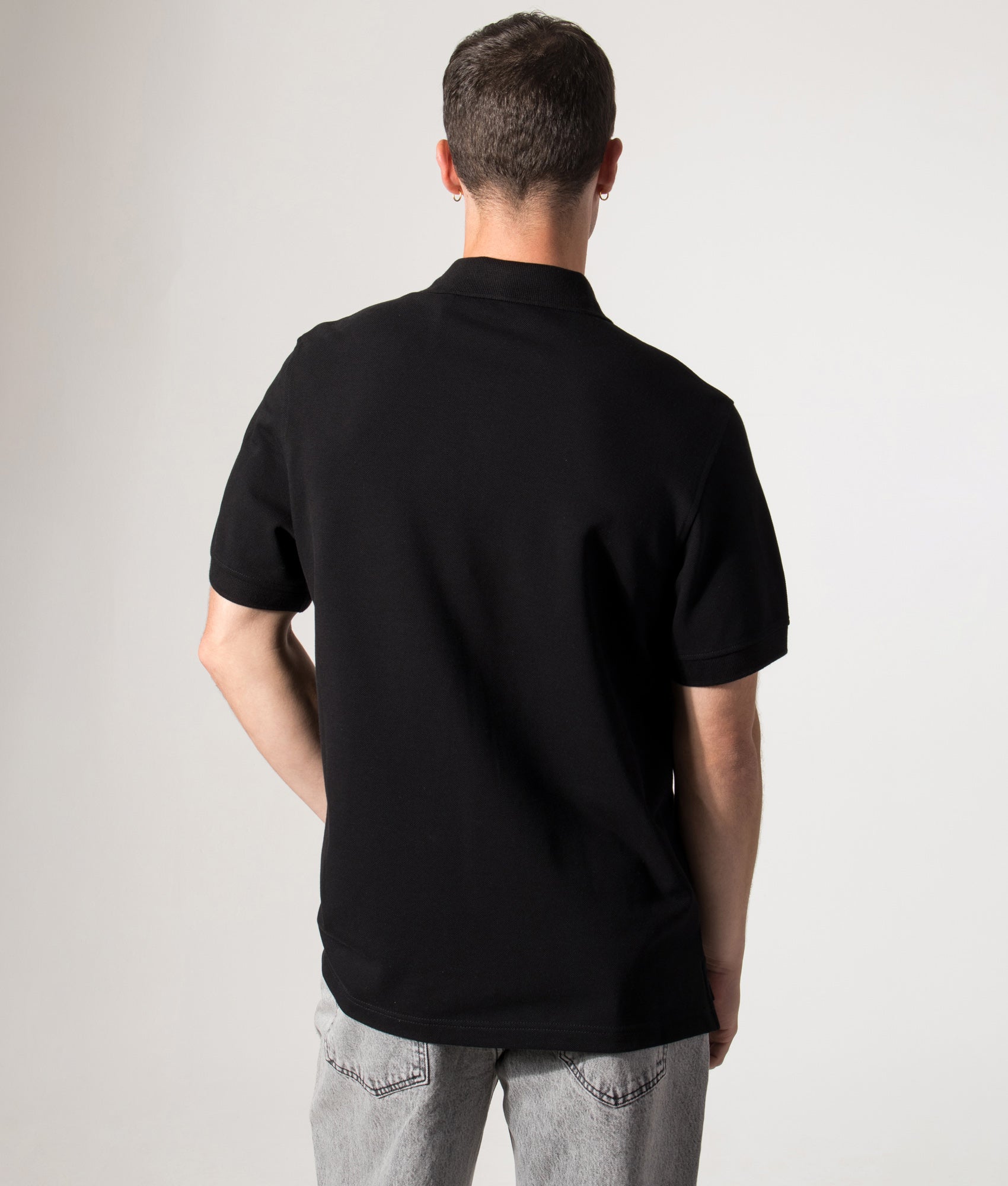 Belstaff Polo Shirt in Black at EQVVS Menswear. Model back shot.