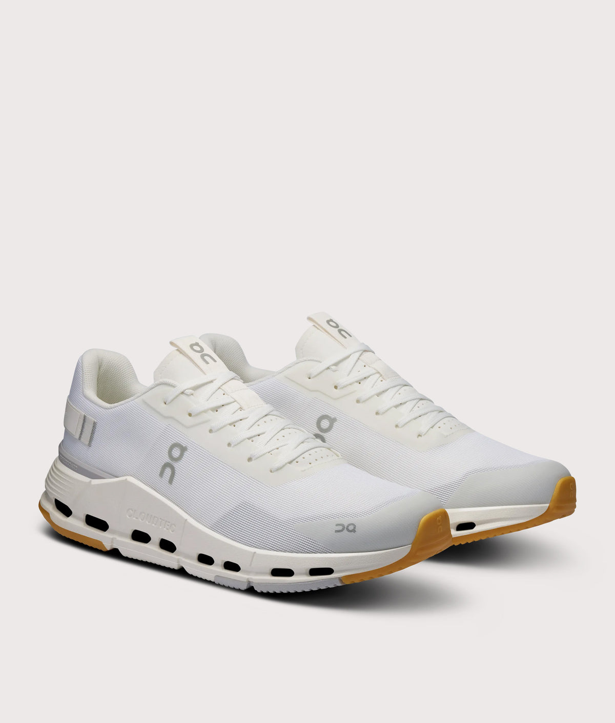 On Cloudnova Form 2 Sneakers in White and Ivory at EQVVS Menswear. Angled front shot.